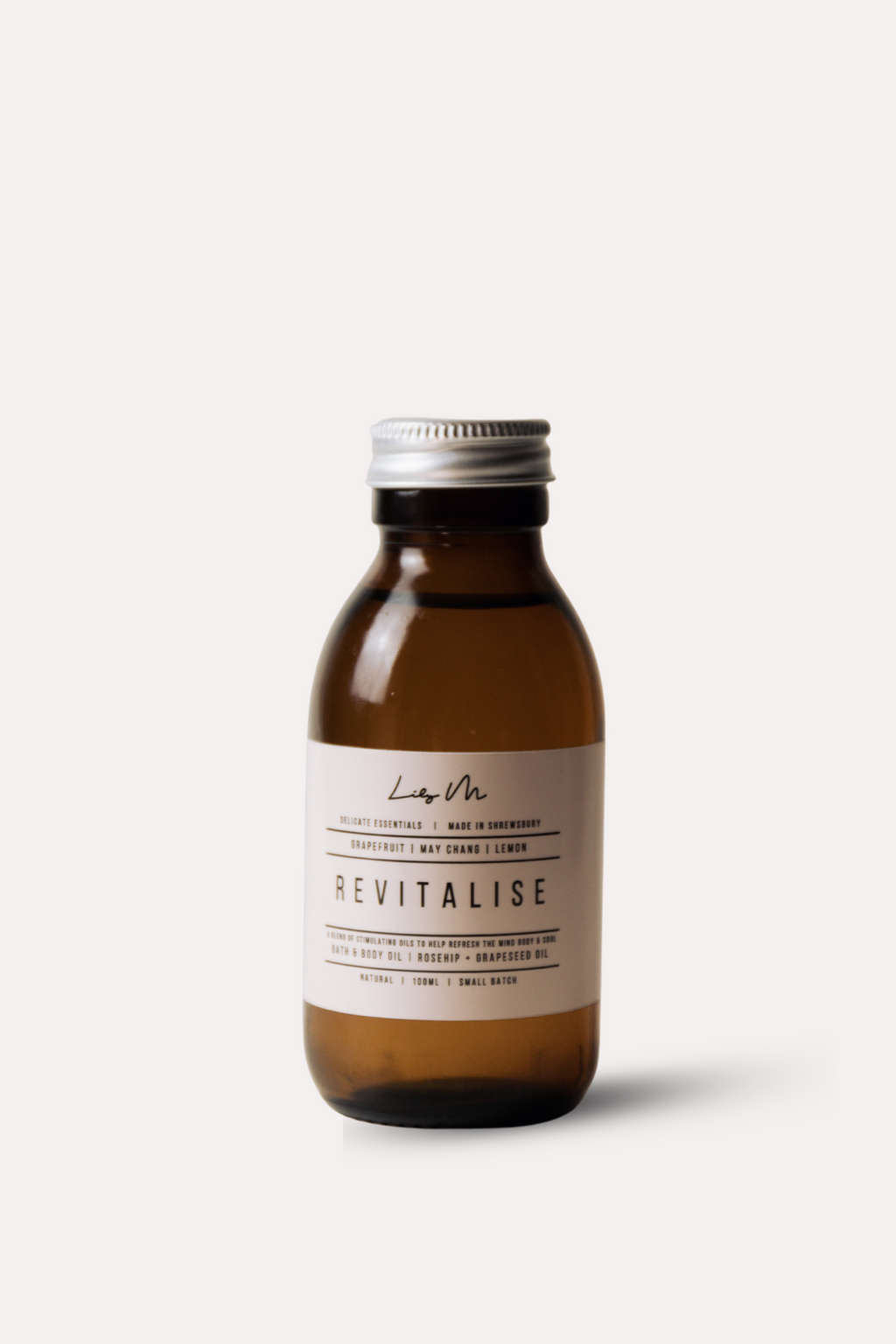 Brown bottle with a silver cap on a white background
