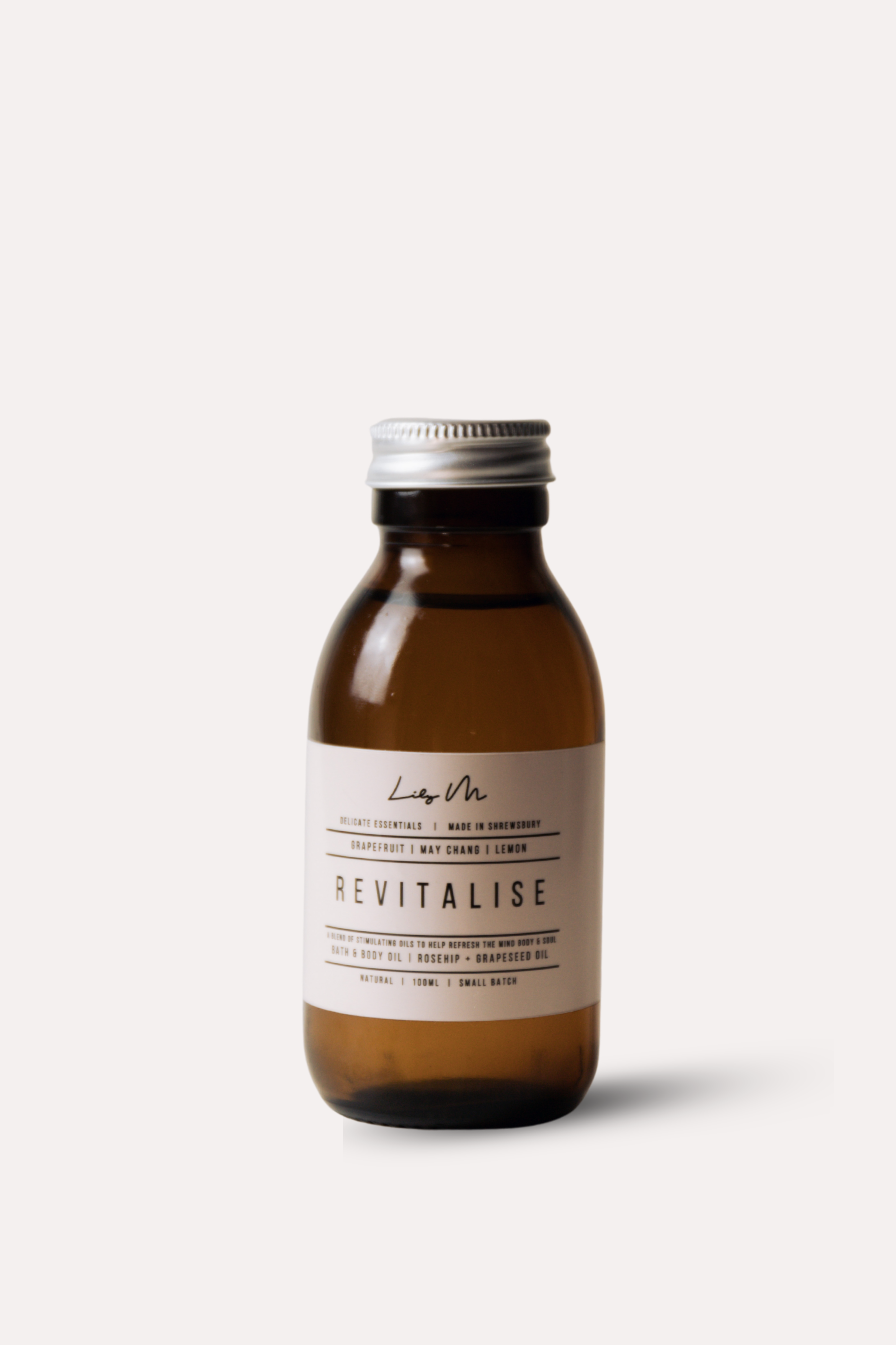 Brown bottle with a silver cap on a white background