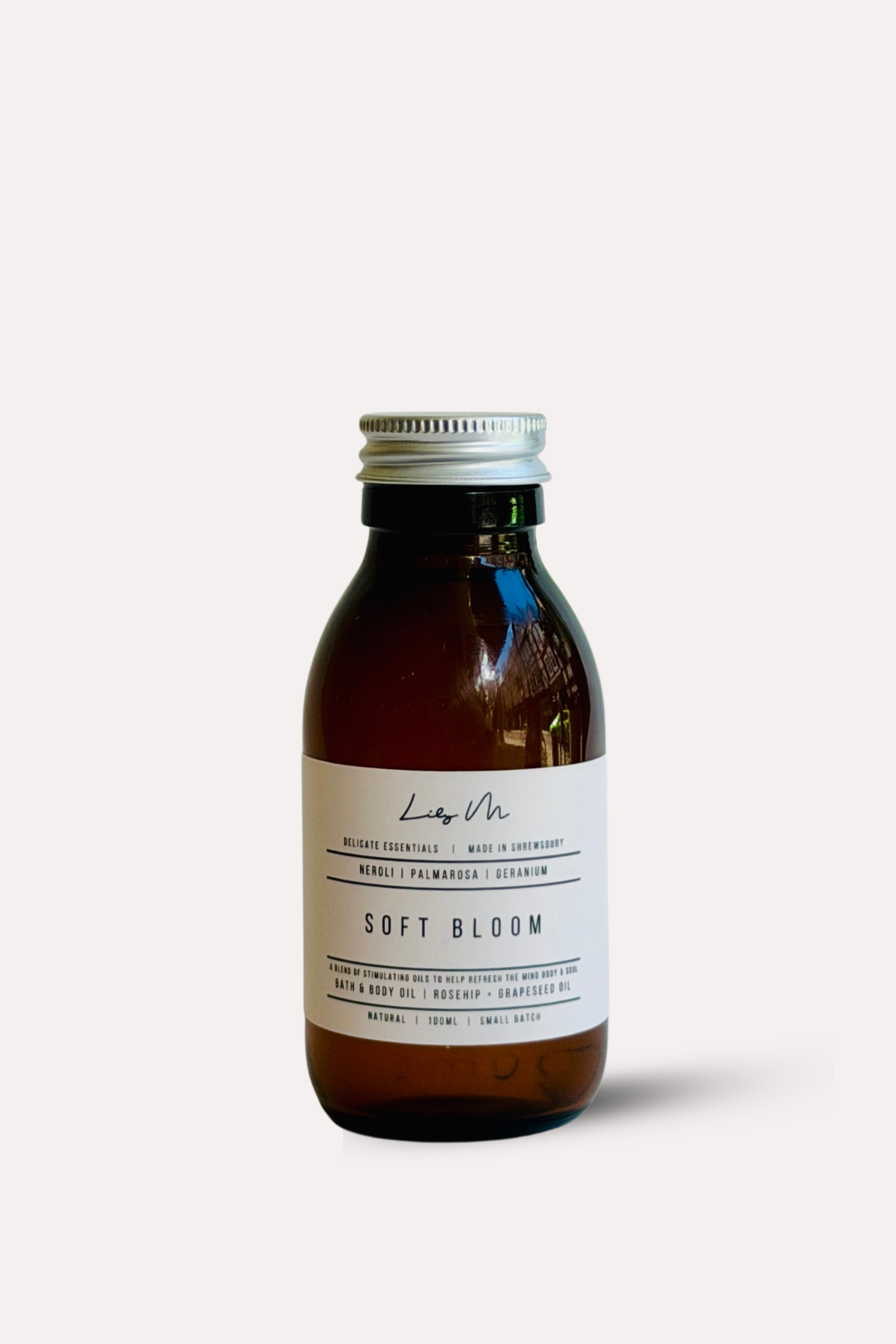 Brown bottle with a white label on a light beige background
