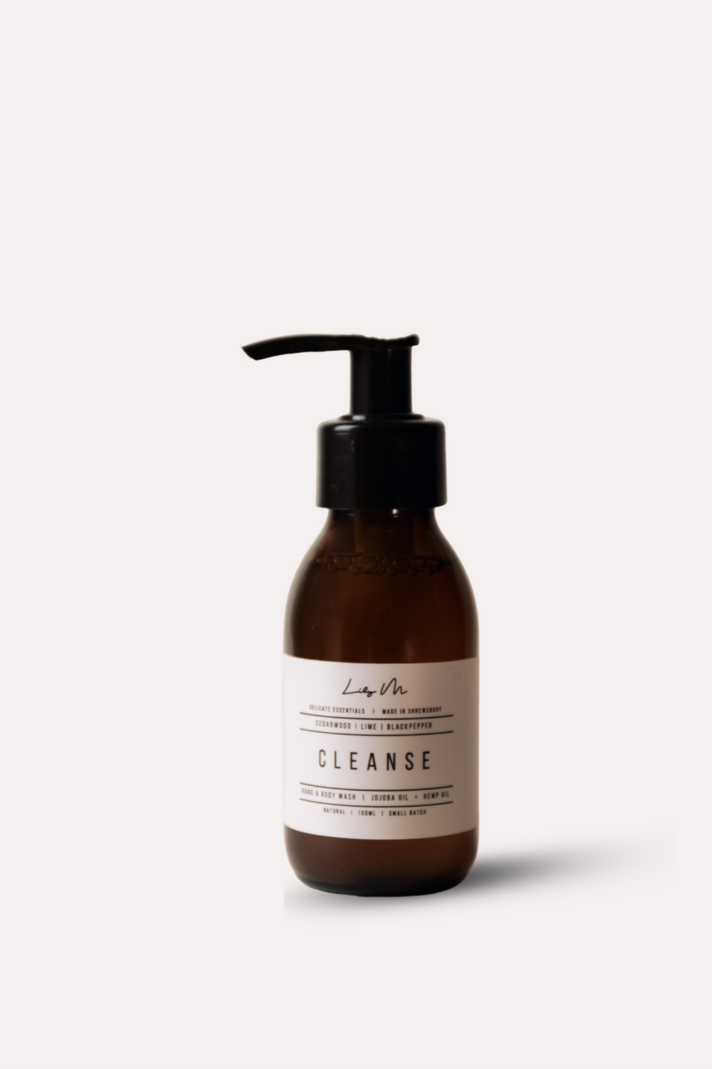 Brown bottle with pump and 'Cleanse' label on a white background