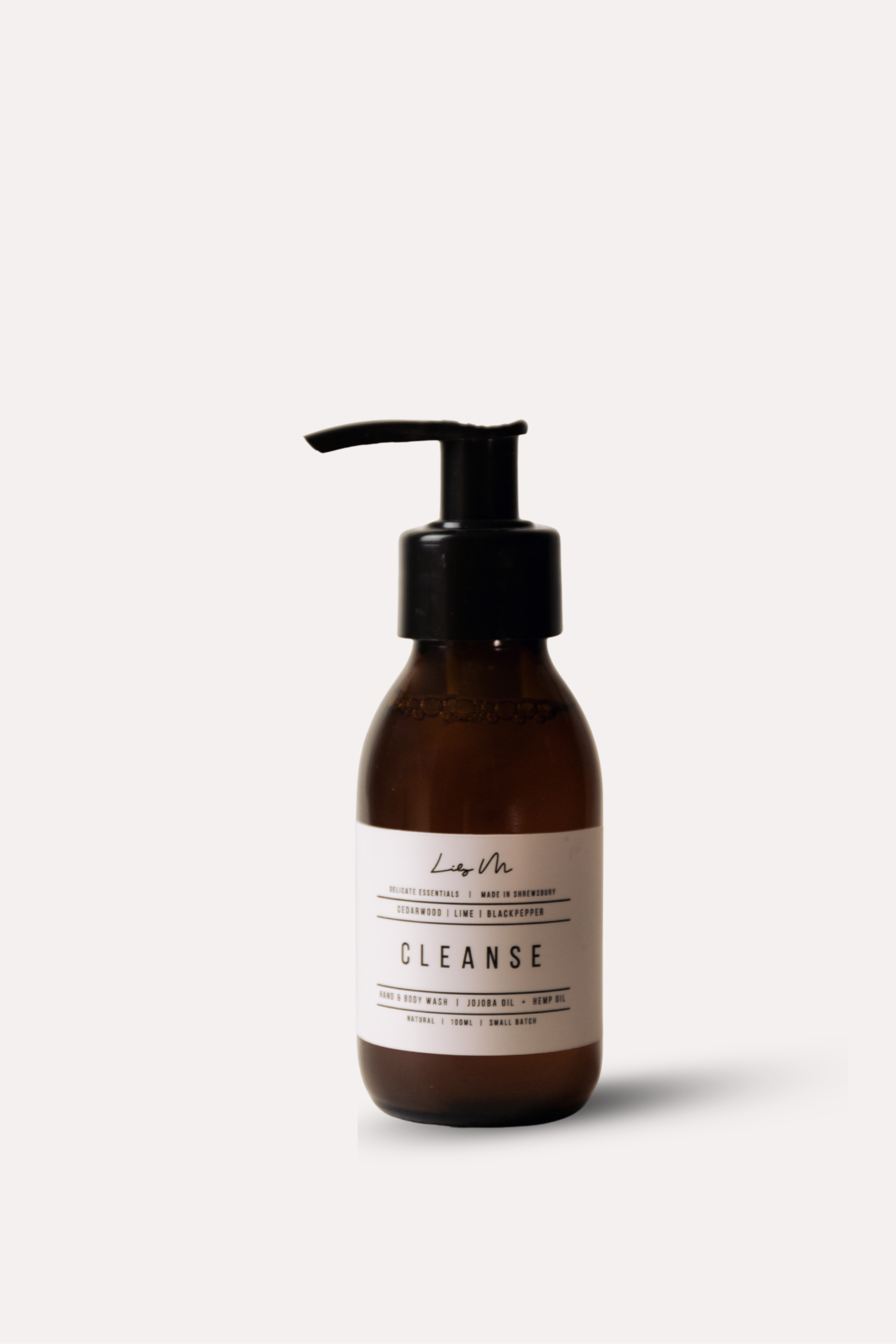 Brown bottle with pump and 'Cleanse' label on a white background