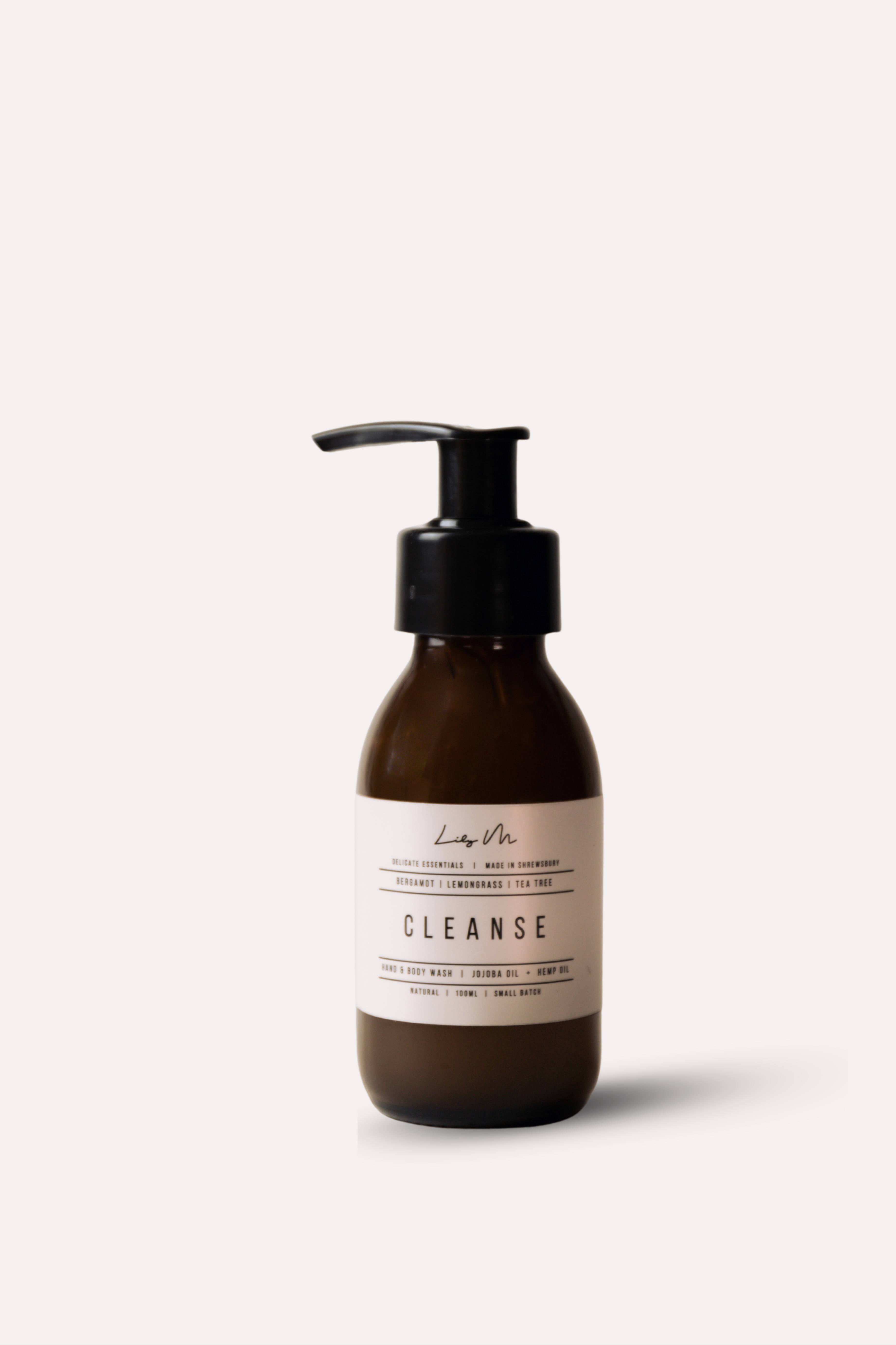 Brown bottle with pump and 'Cleanse' label on a white background