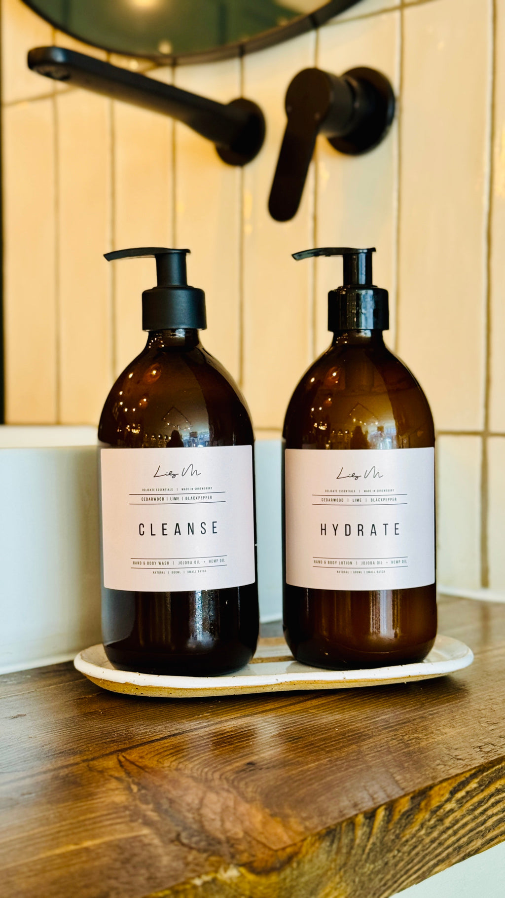 Cedarwood lime & Black pepper hand & Body lotion and Hand & Body wash on the white stoneware glazed tray