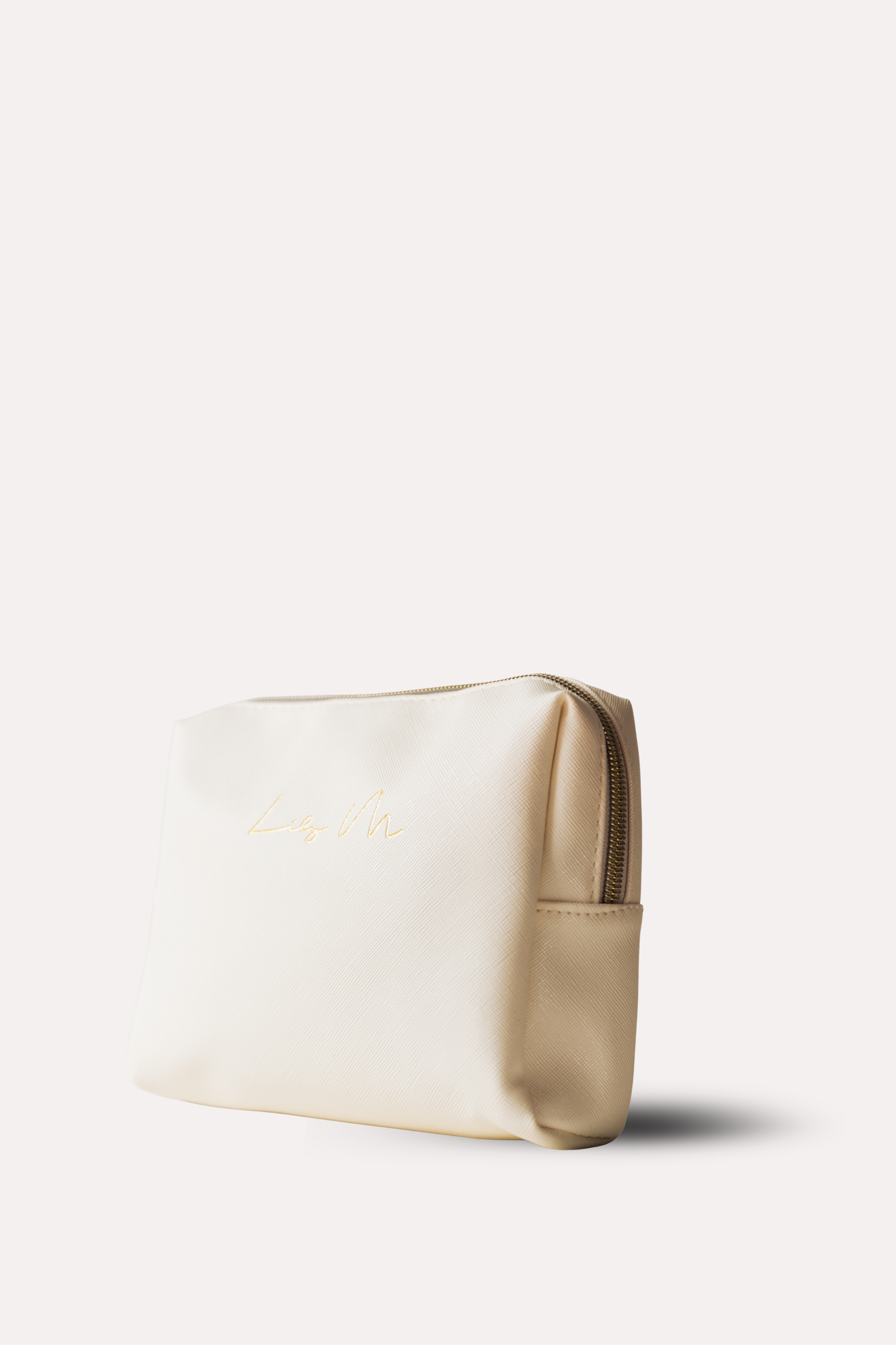 White pouch with beige flap on a white background