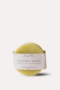Yellow conditioner bar with a label on a white background