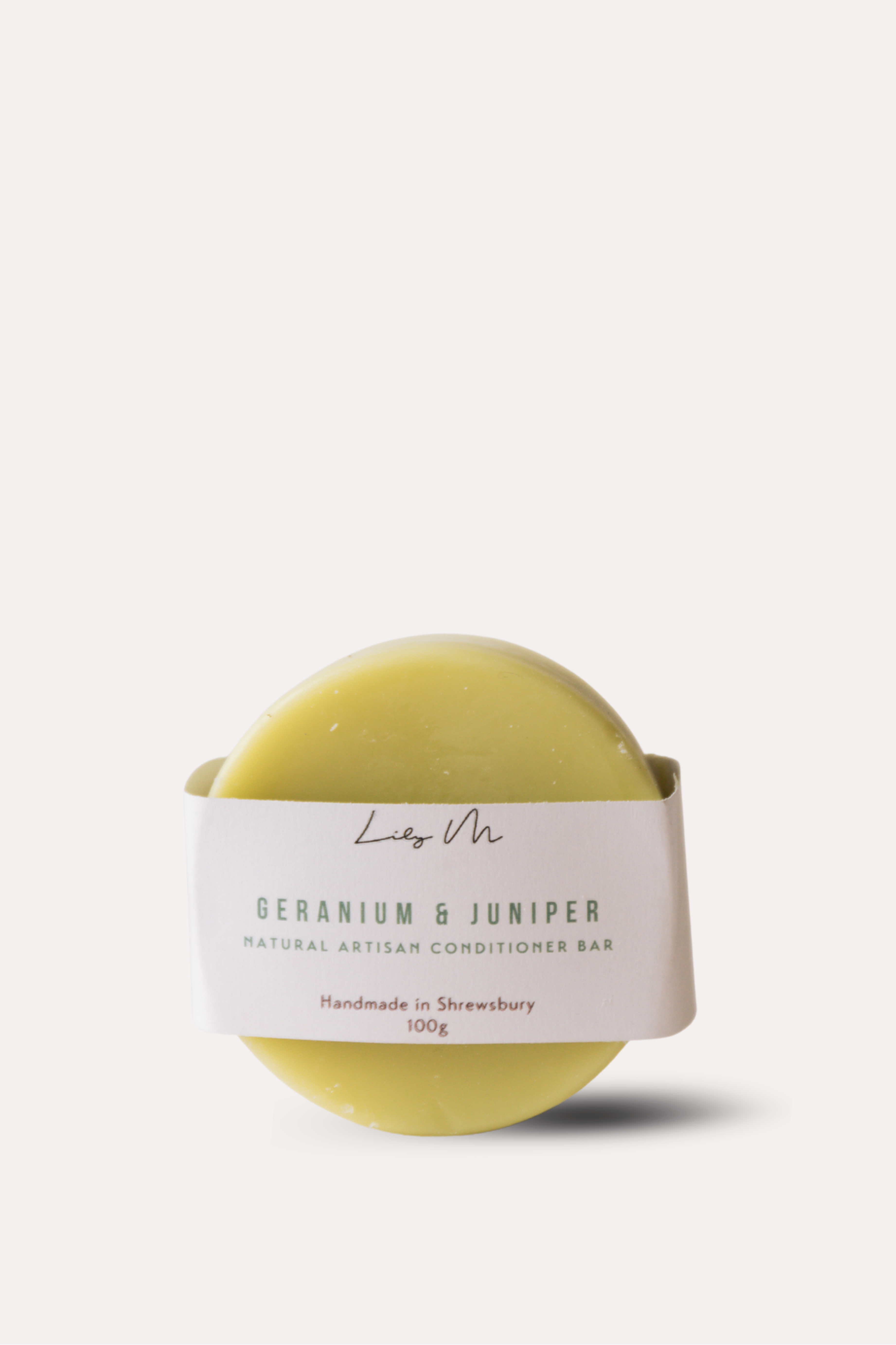 Yellow conditioner bar with a label on a white background