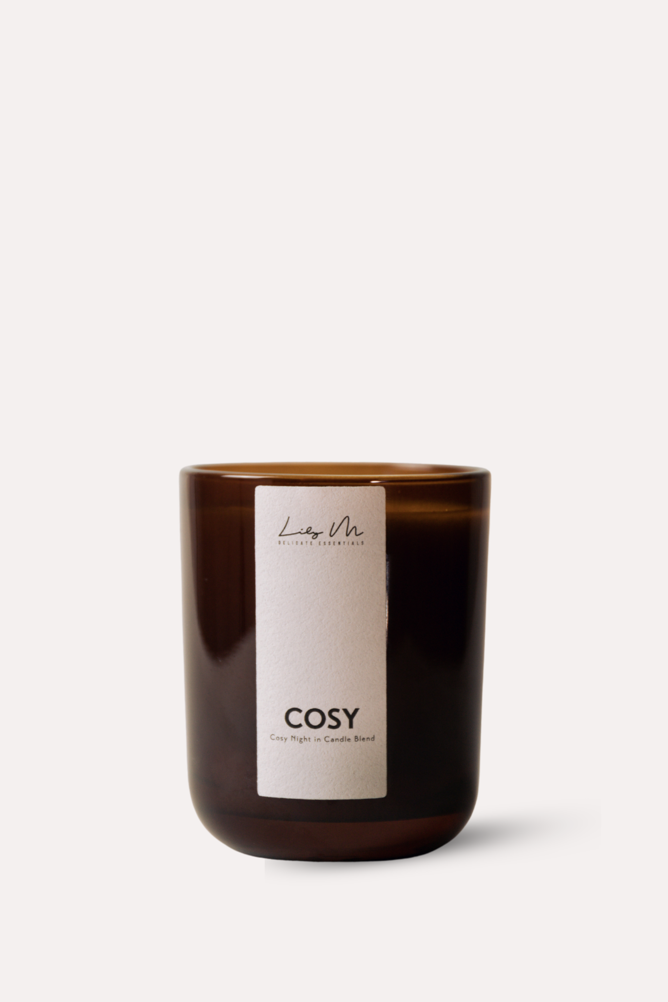 Brown candle with a white label on a white background