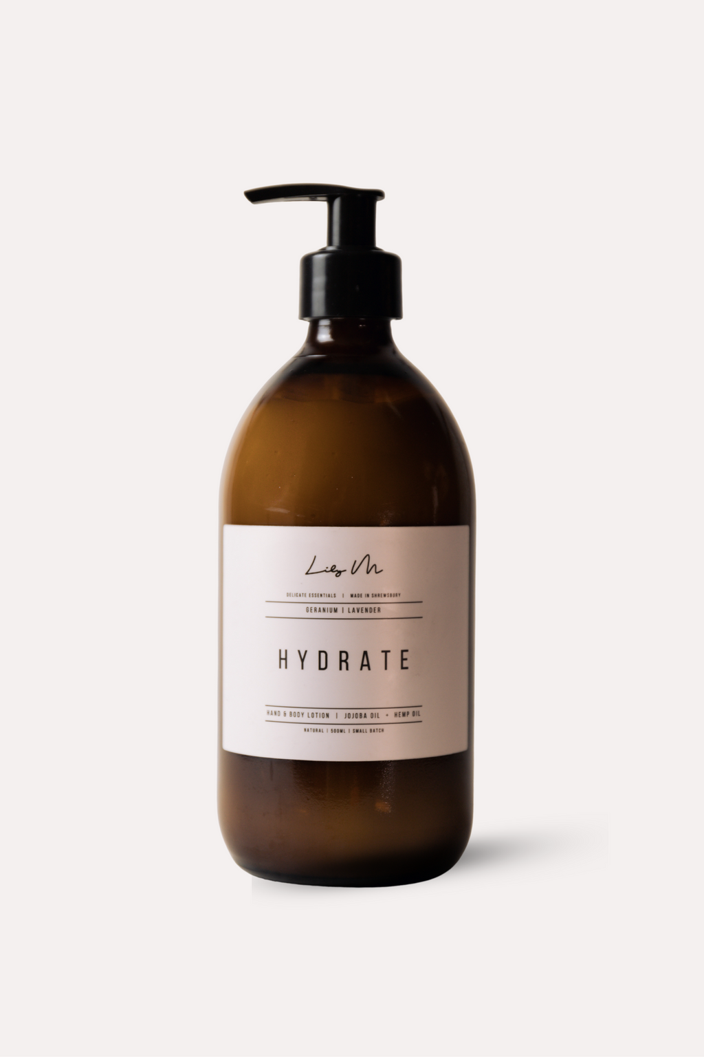 Brown bottle with pump and 'Hydrate' label on a white background