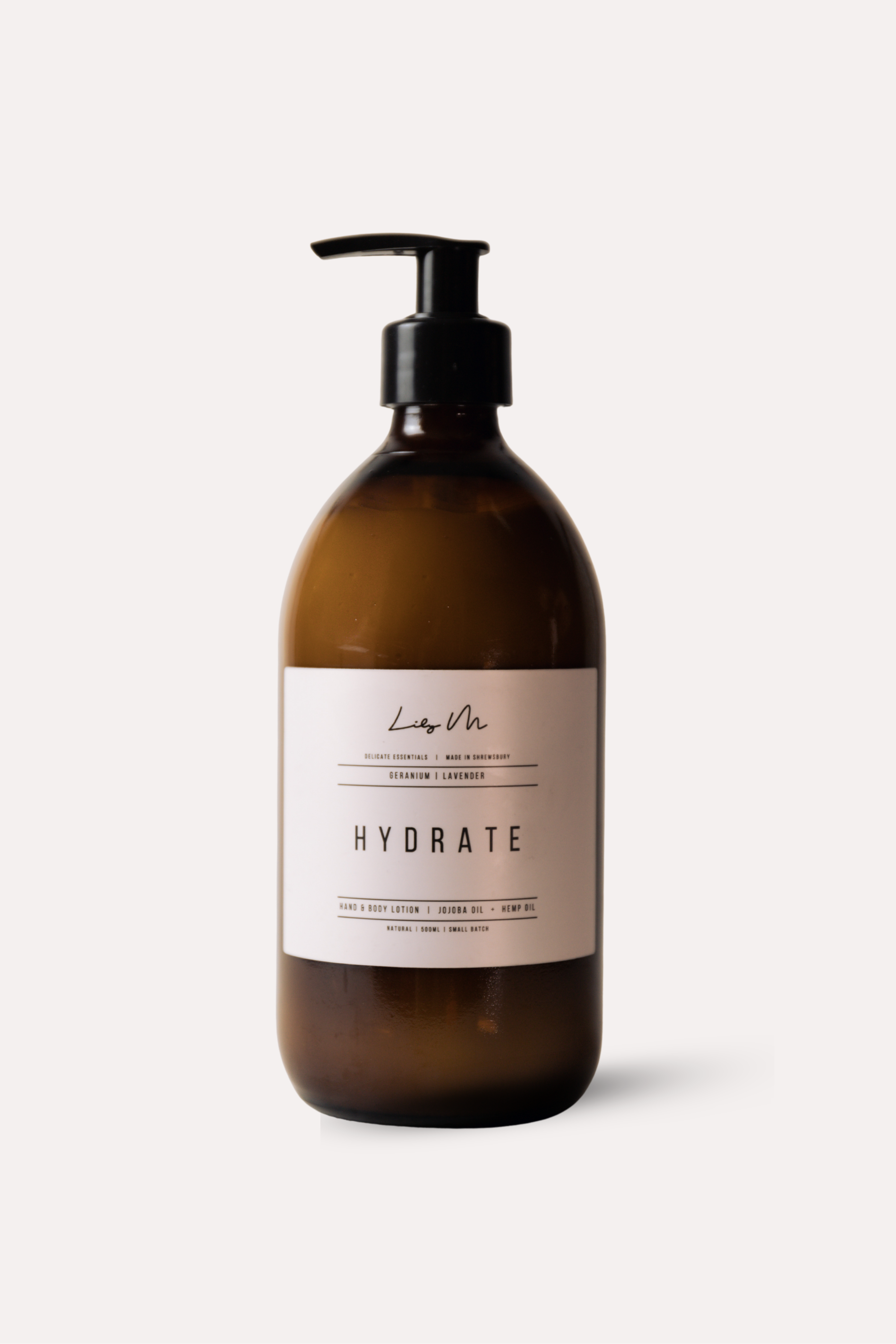 Brown bottle with pump and 'Hydrate' label on a white background