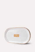 Rectangular ceramic tray with gold rim on a white background