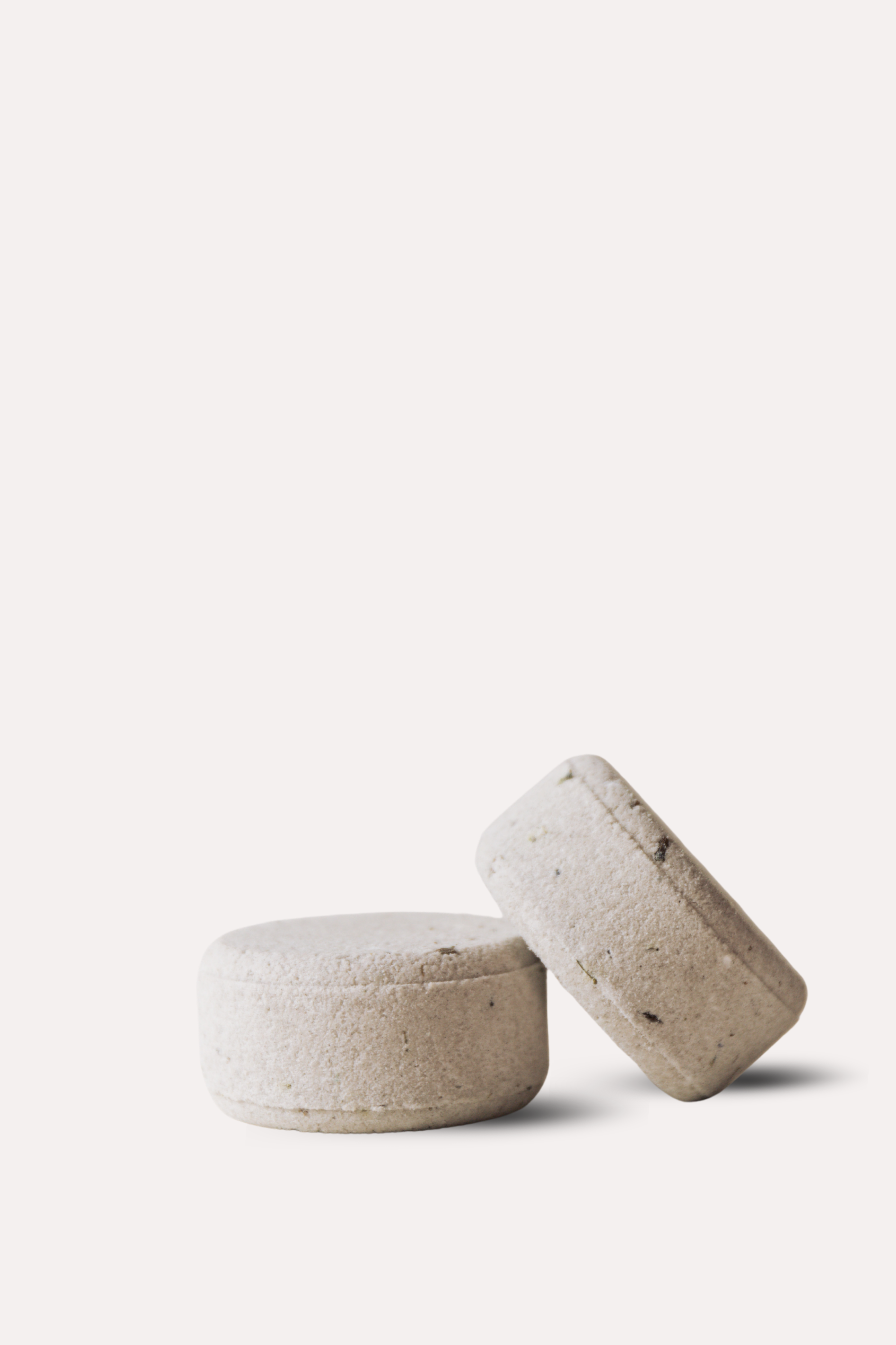 Two lavender bath bombs on a white background 