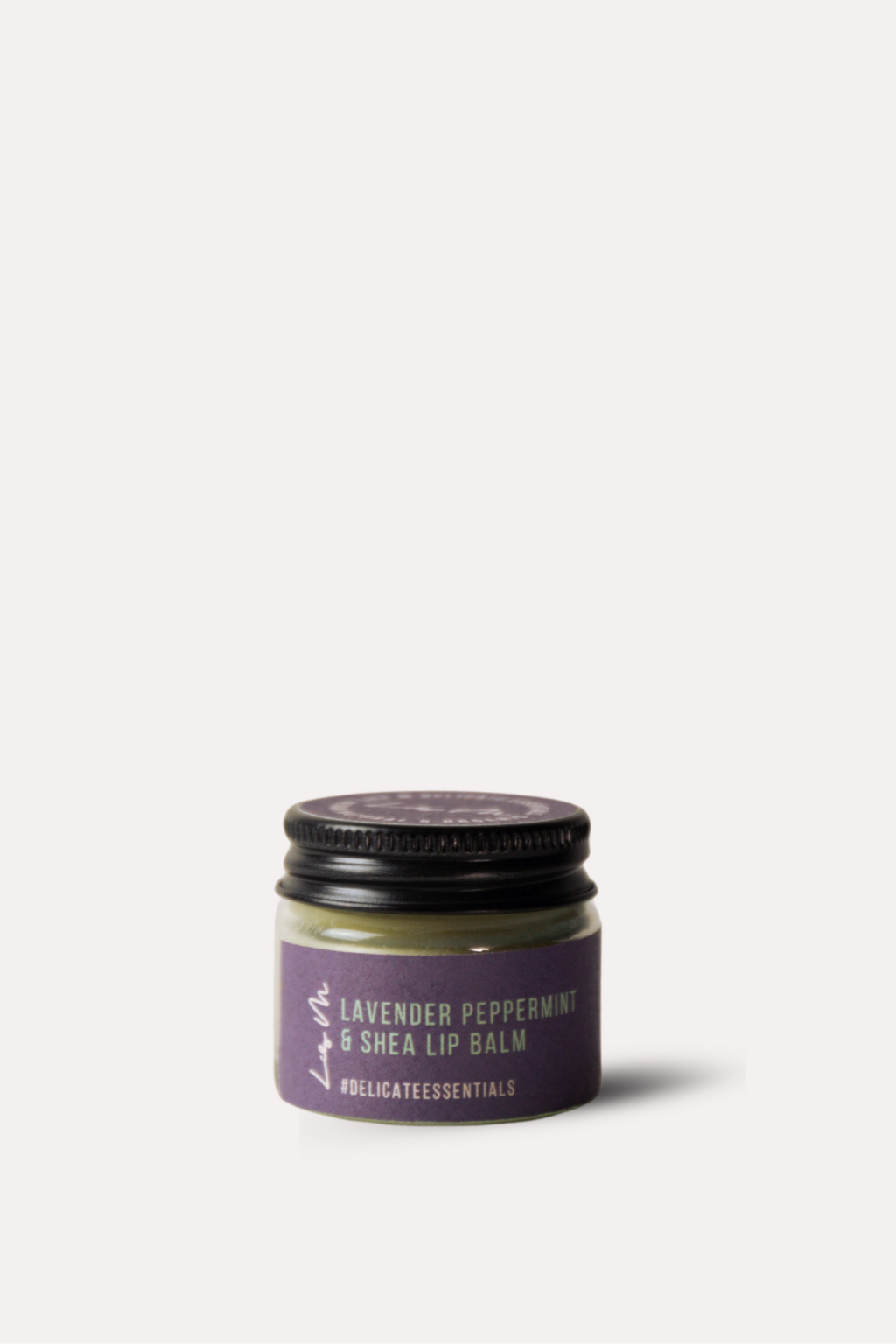 Jar of lavender peppermint shea lip balm on a white background