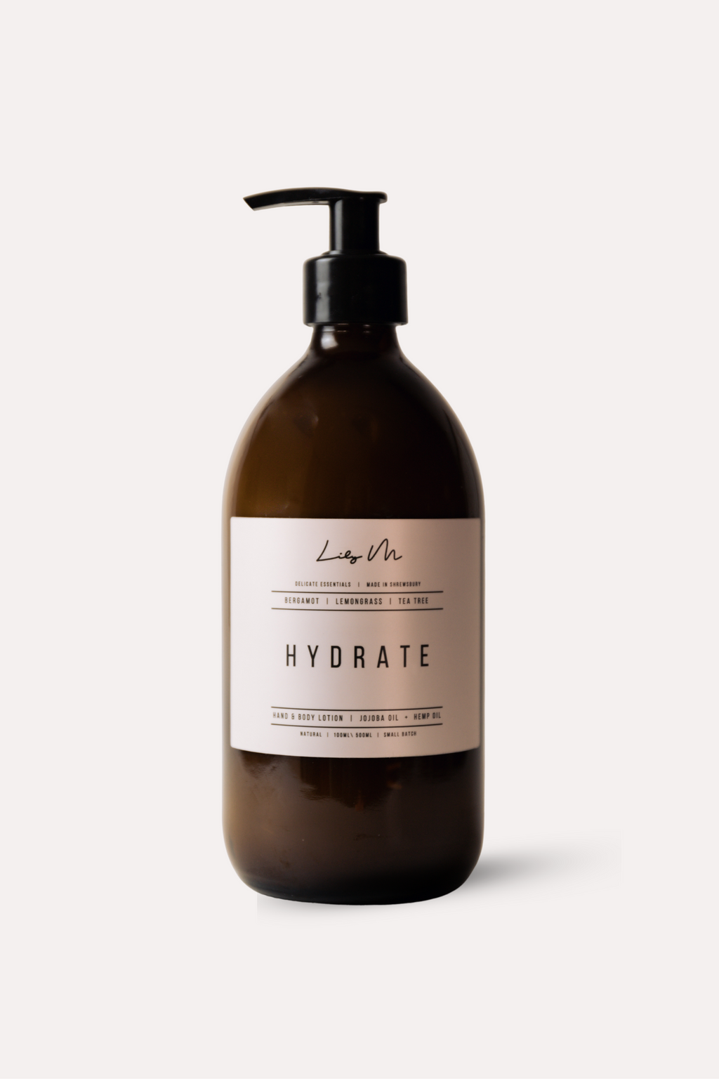 Brown bottle with pump labeled 'Hydrate' on a white background