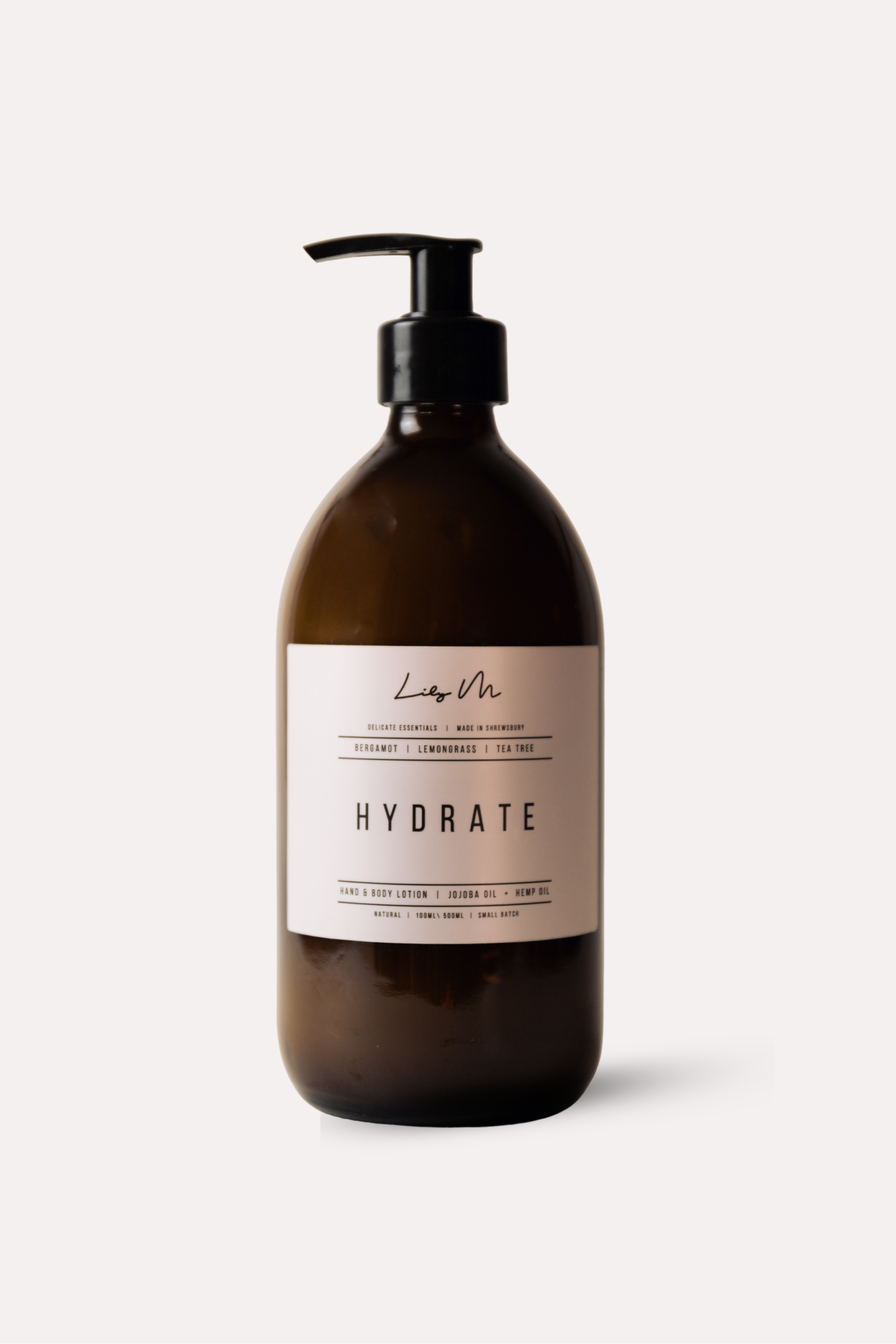 Brown bottle with pump labeled 'Hydrate' on a white background