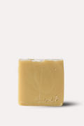 Bar of soap with a brand logo on a white background