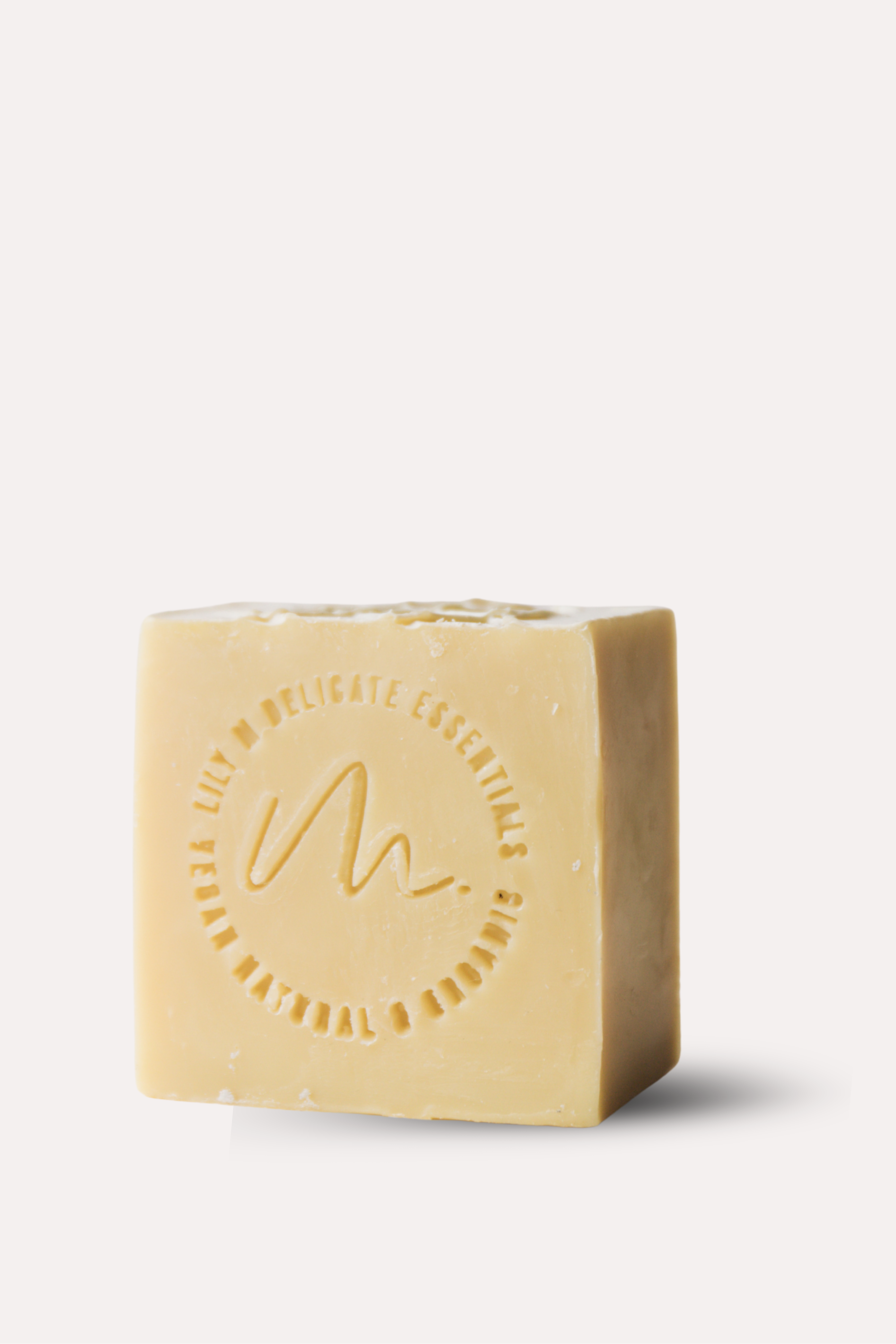 Bar of soap with a circular logo on a white background