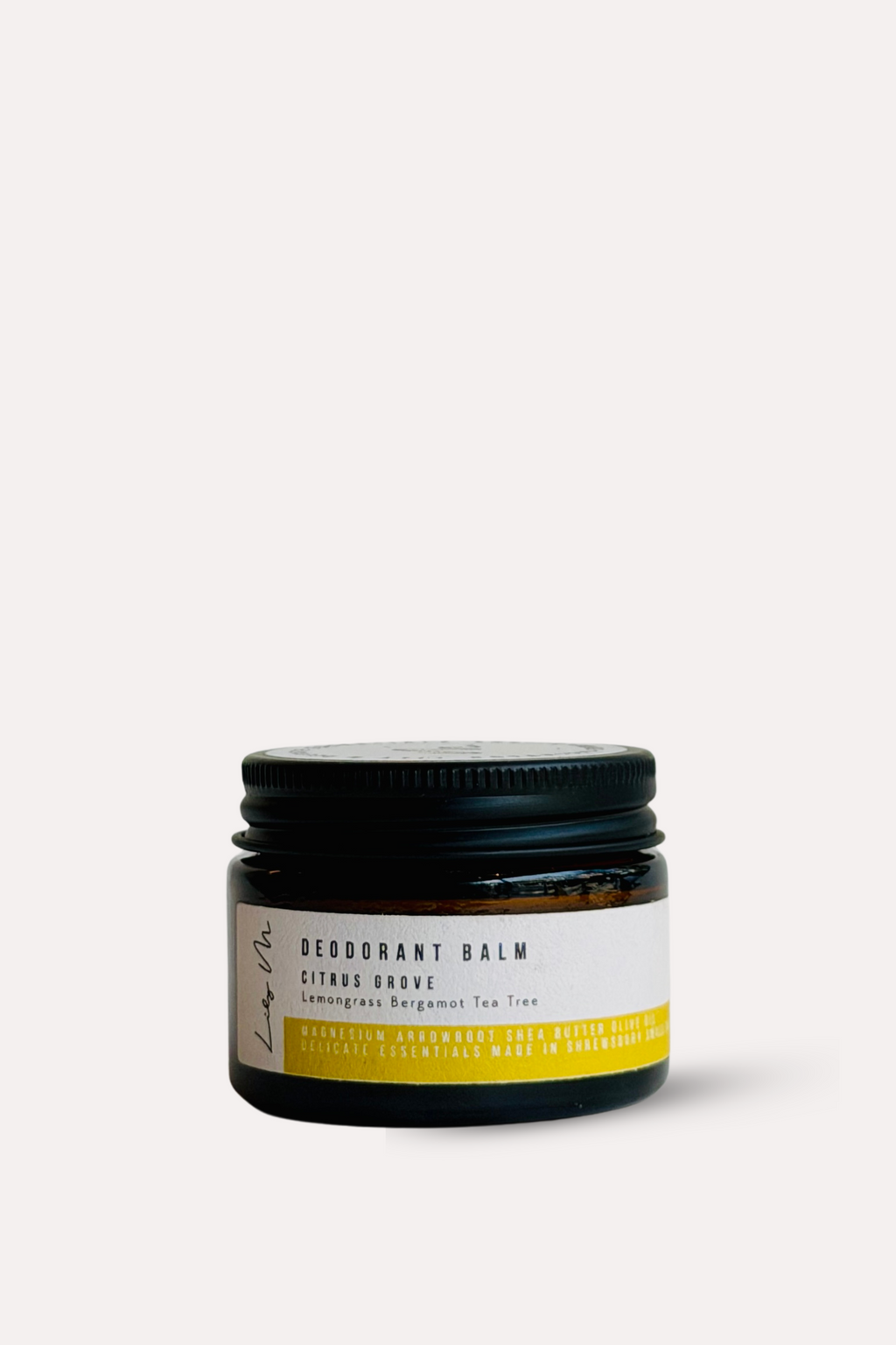 Jar of deodorant balm with a black lid on a white background