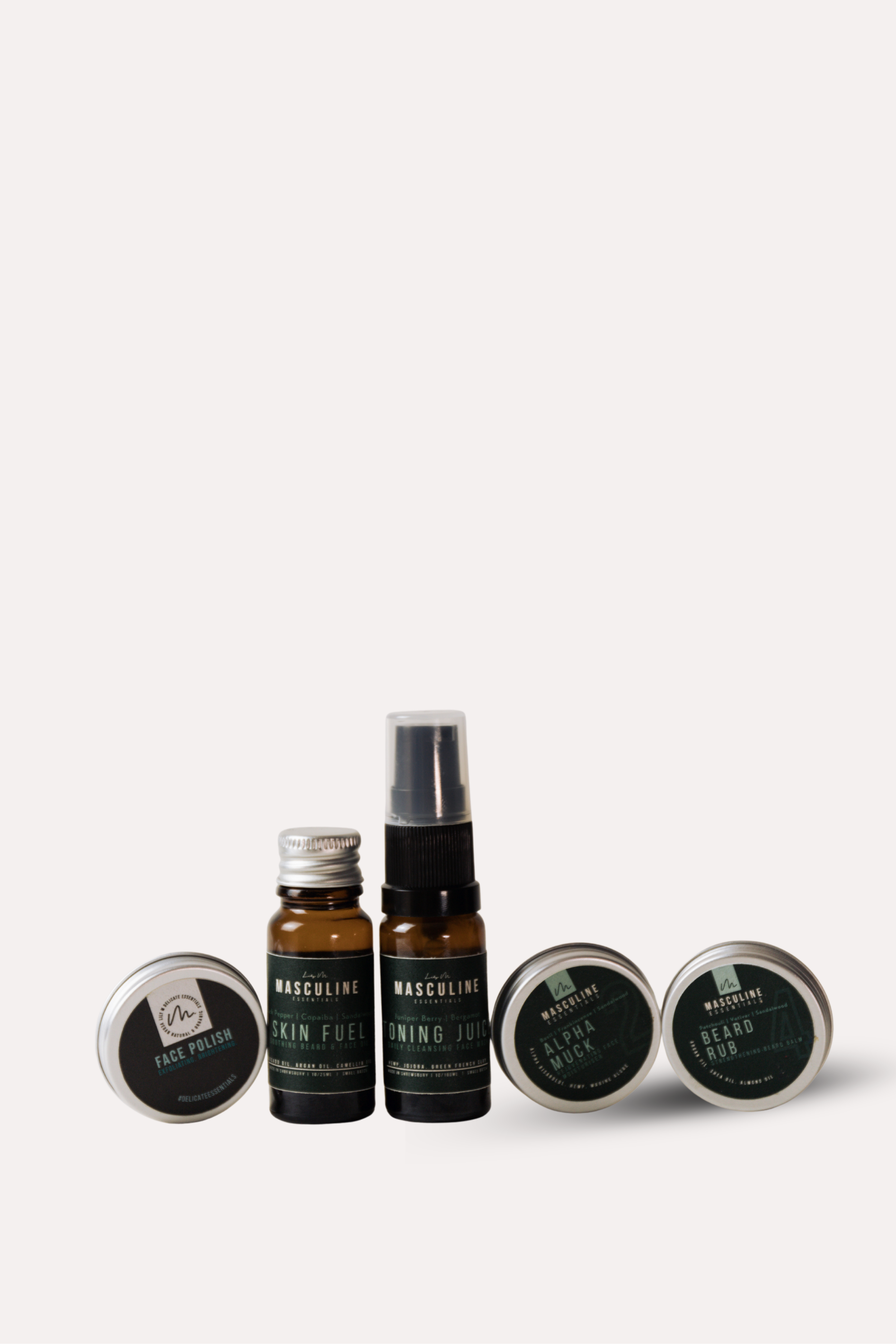 Set of skincare products including bottles and jars on a white background -mens skincare kit
