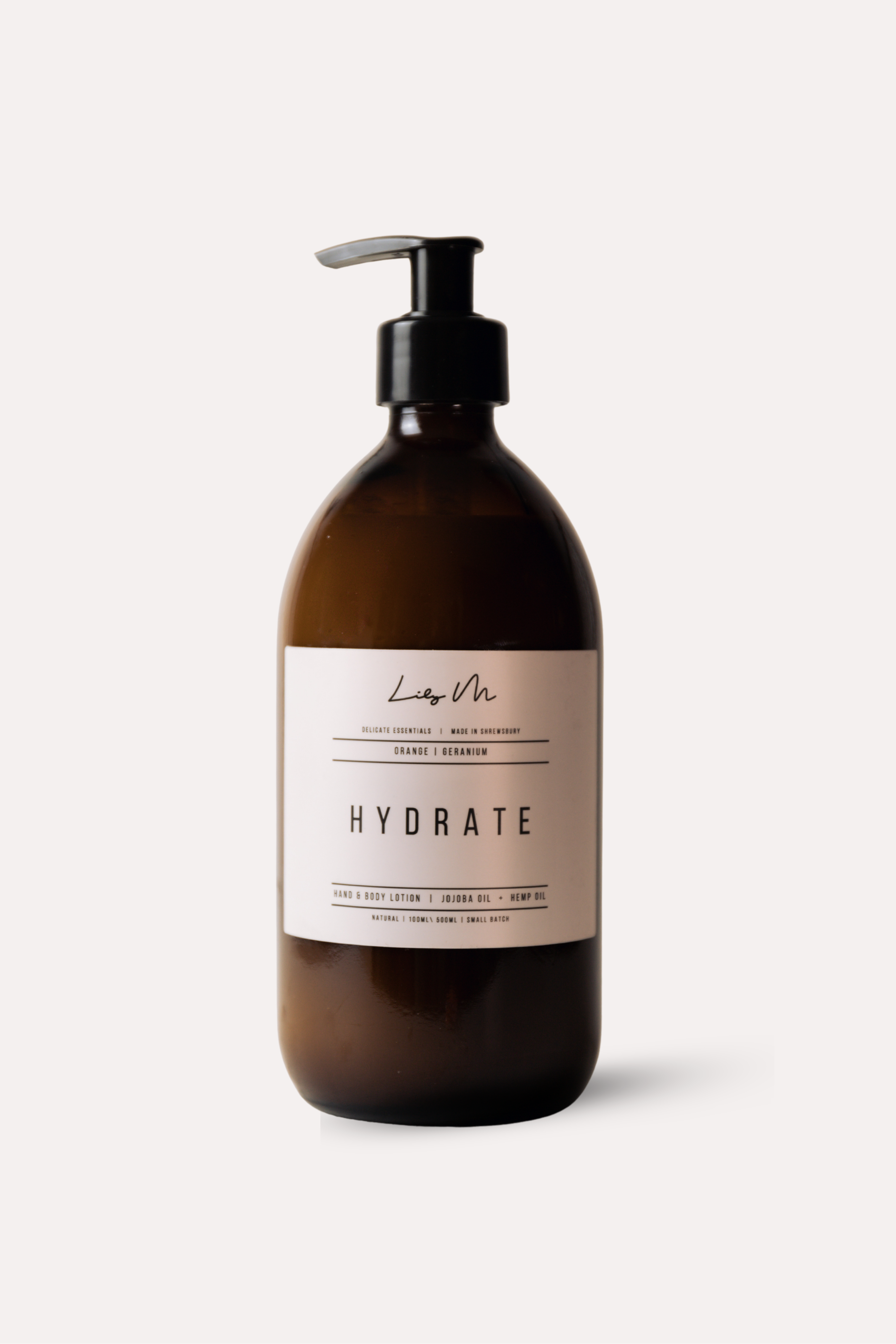 Brown bottle with pump and 'Hydrate' label on a white background