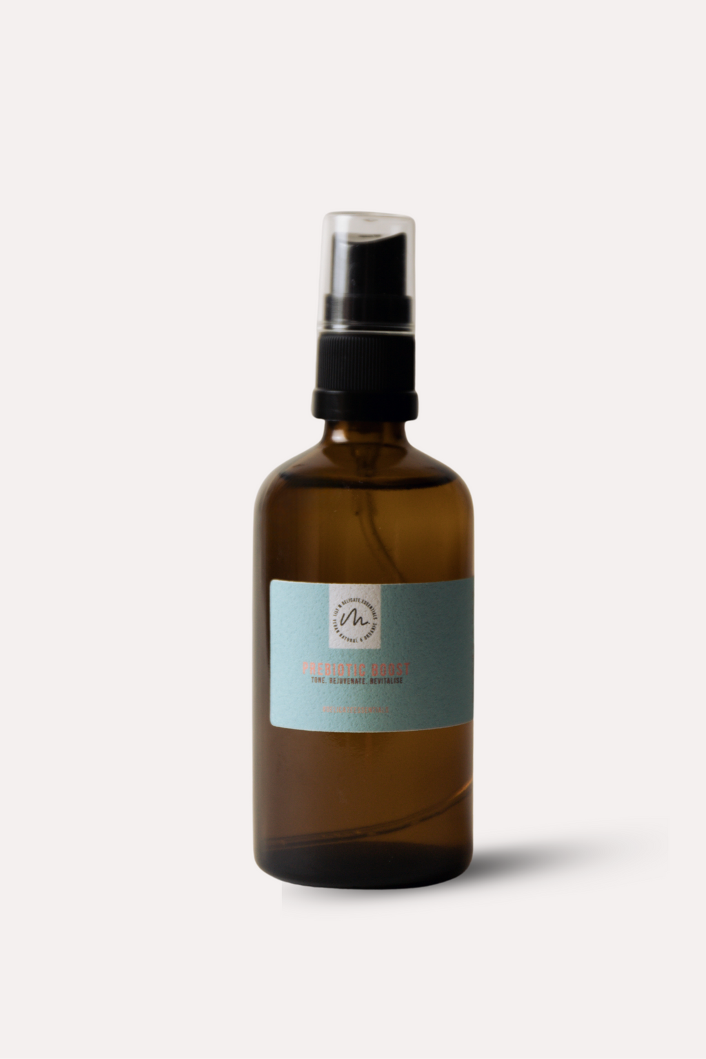 Brown spray bottle with a label on a light gray background
