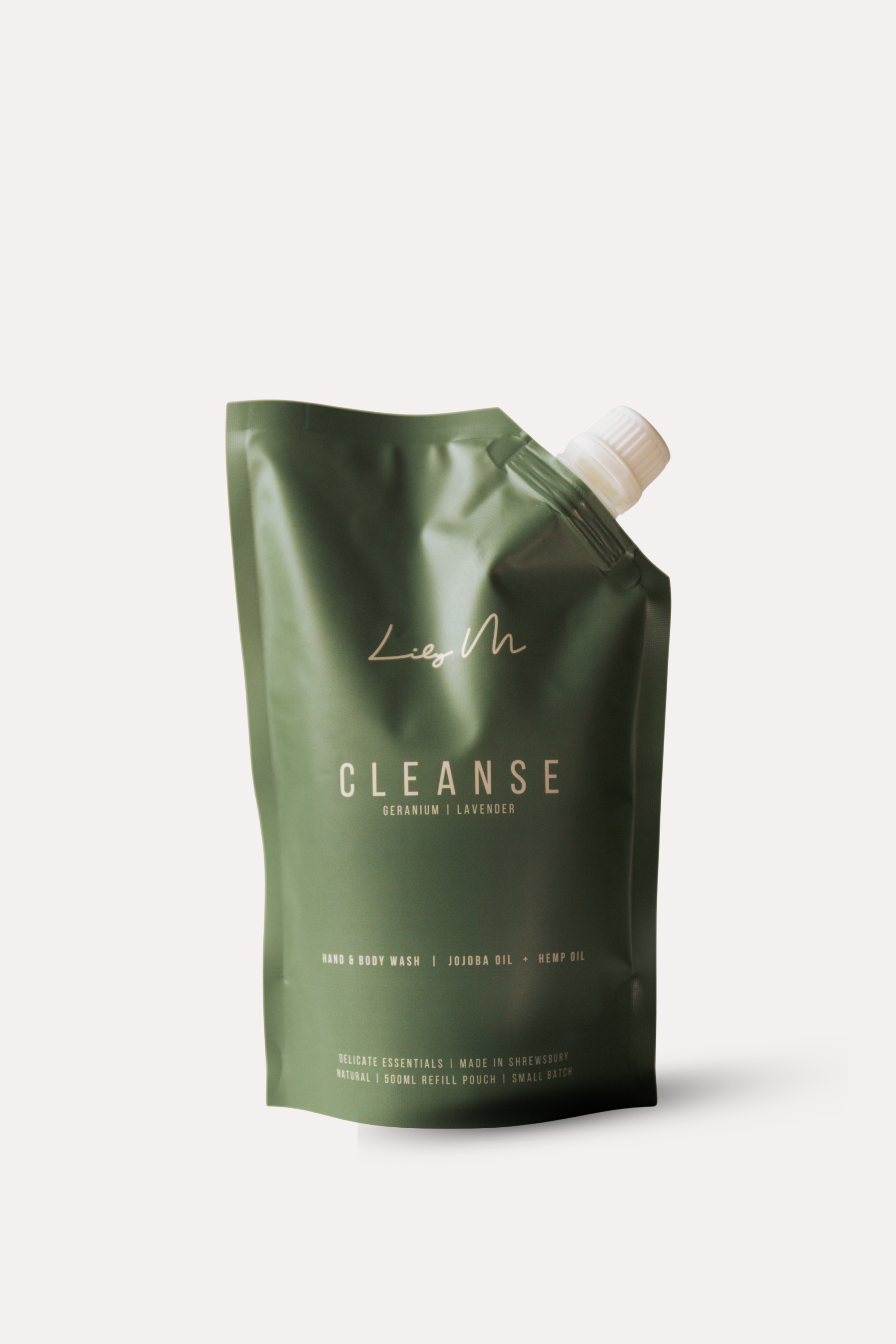 Green packaging of a product labeled 'Cleanse' on a white background refill pouch