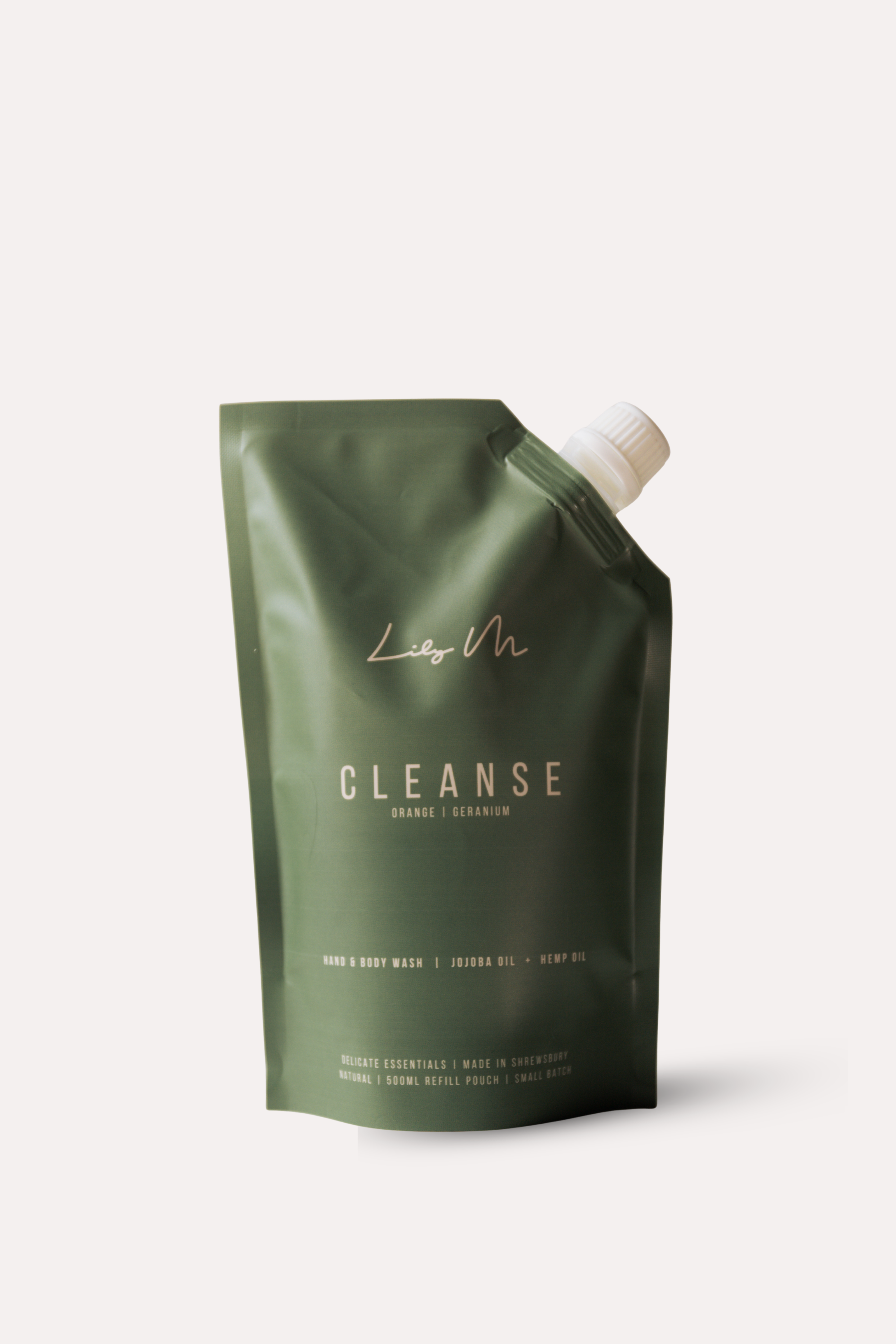 Green packaging with a white pump on a light gray background - refill pouch