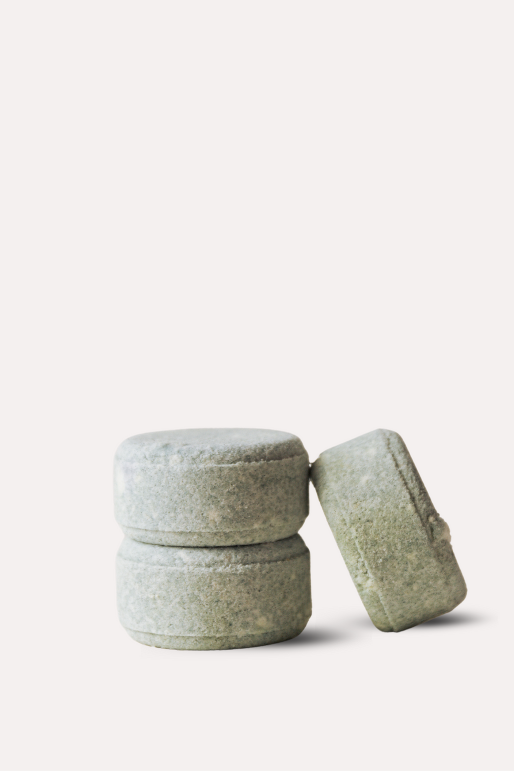 Two gray stone containers on a white background