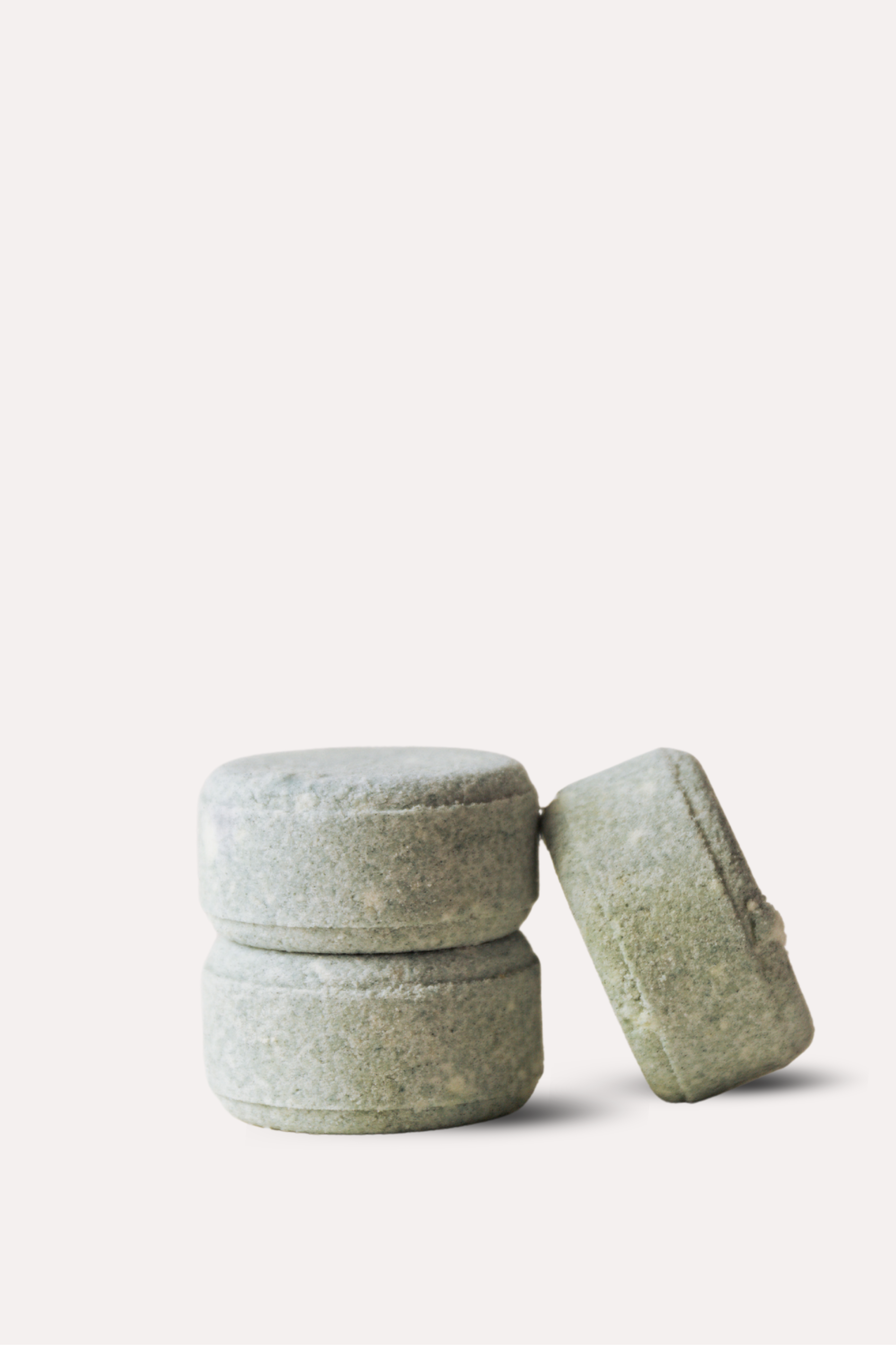 Two gray stone containers on a white background
