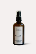 Brown spray bottle with a label on a white background