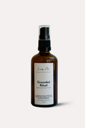Brown spray bottle labeled 'Grounded Ritual' on a white background