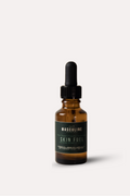 Bottle of 'Skin Fuel' with dropper on a white background - mens face and beard oil 
