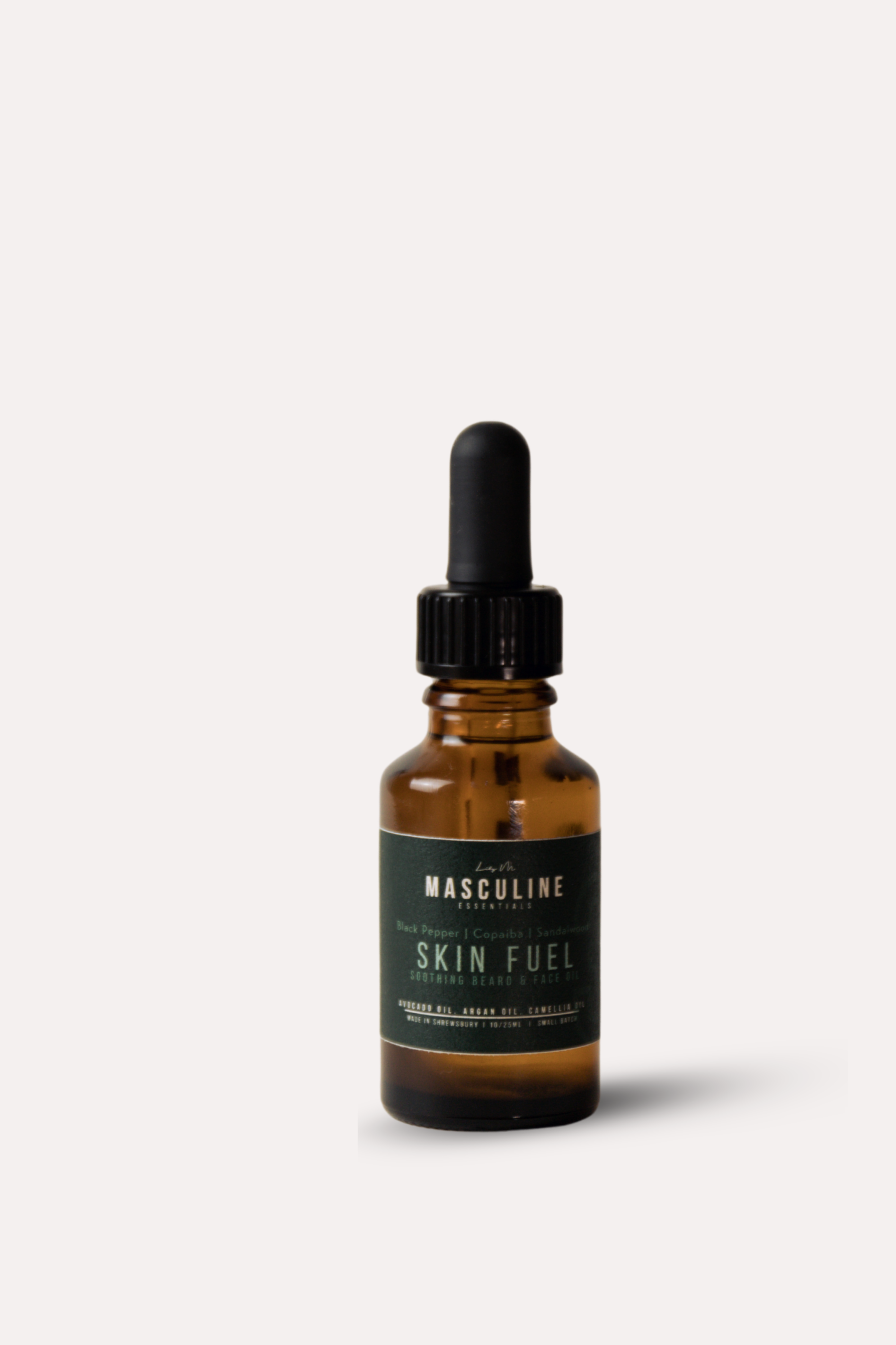 Bottle of 'Skin Fuel' with dropper on a white background - mens face and beard oil 