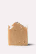 Bar of soap with a visible brand logo on a white background