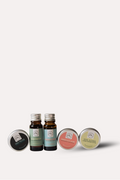 Set of small bottles and containers on a white background