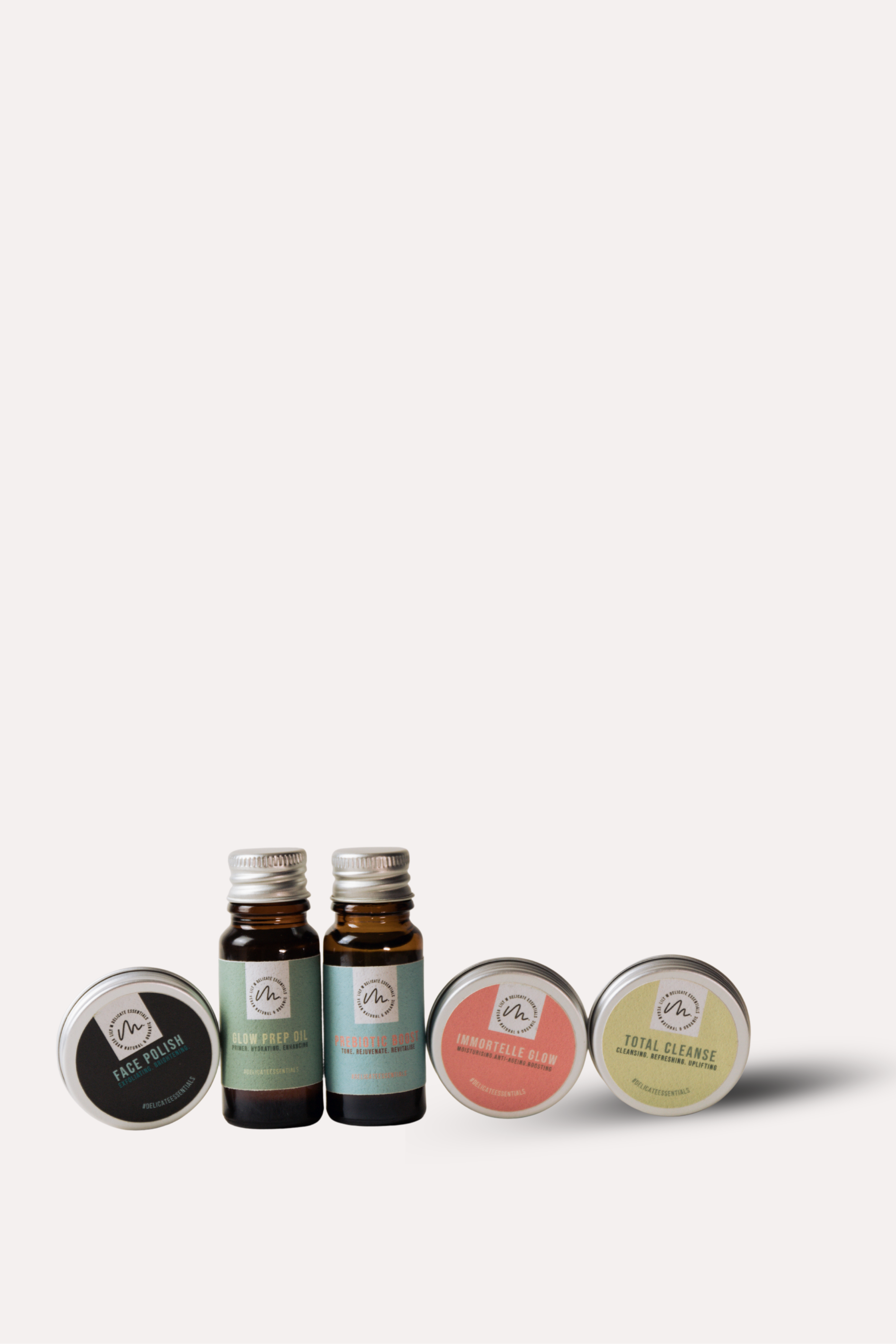 Set of small bottles and containers on a white background