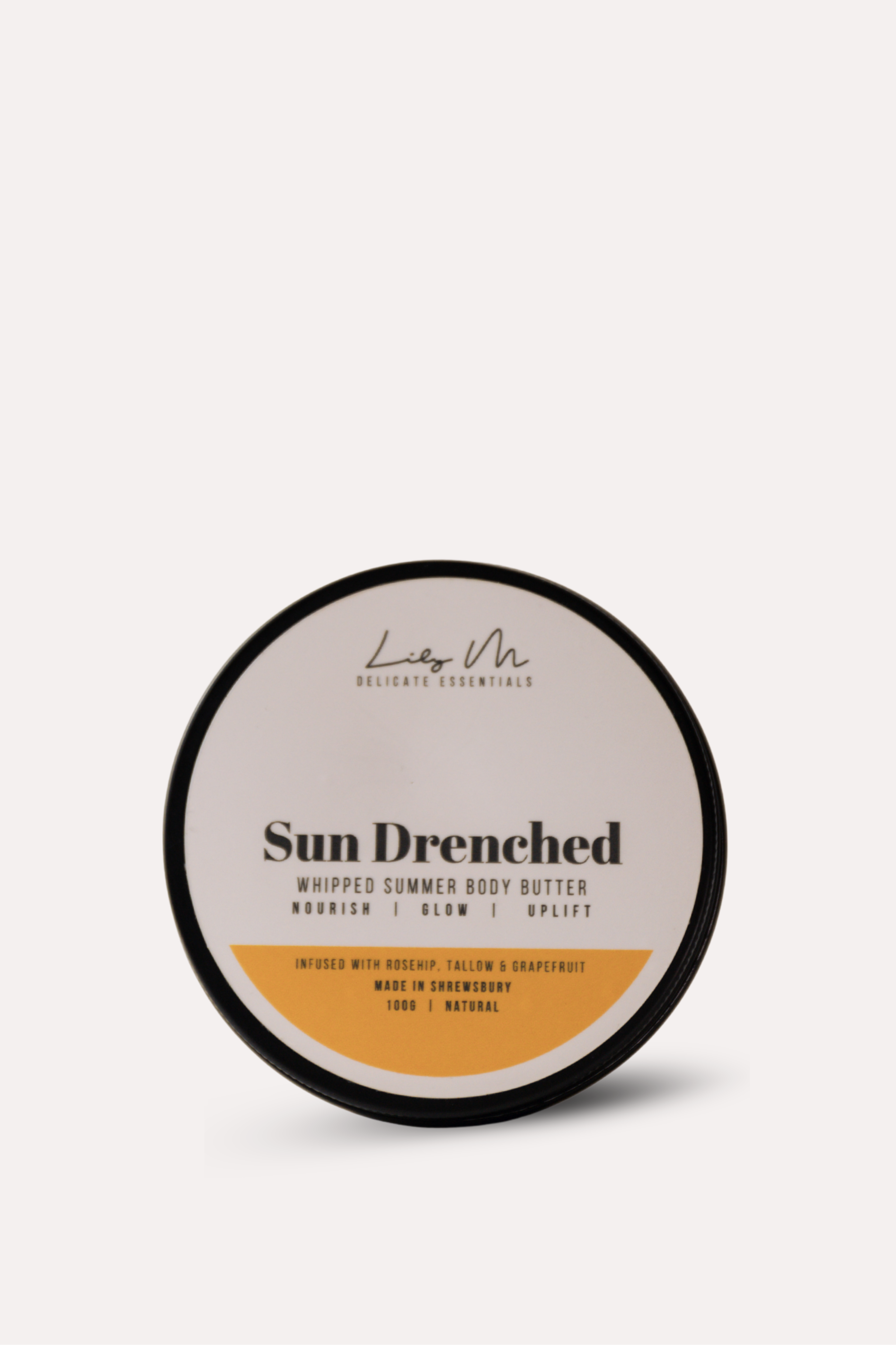 Sun Drenched whipped summer body butter container on a white background