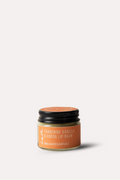 Jar of lip balm with a black lid on a white background