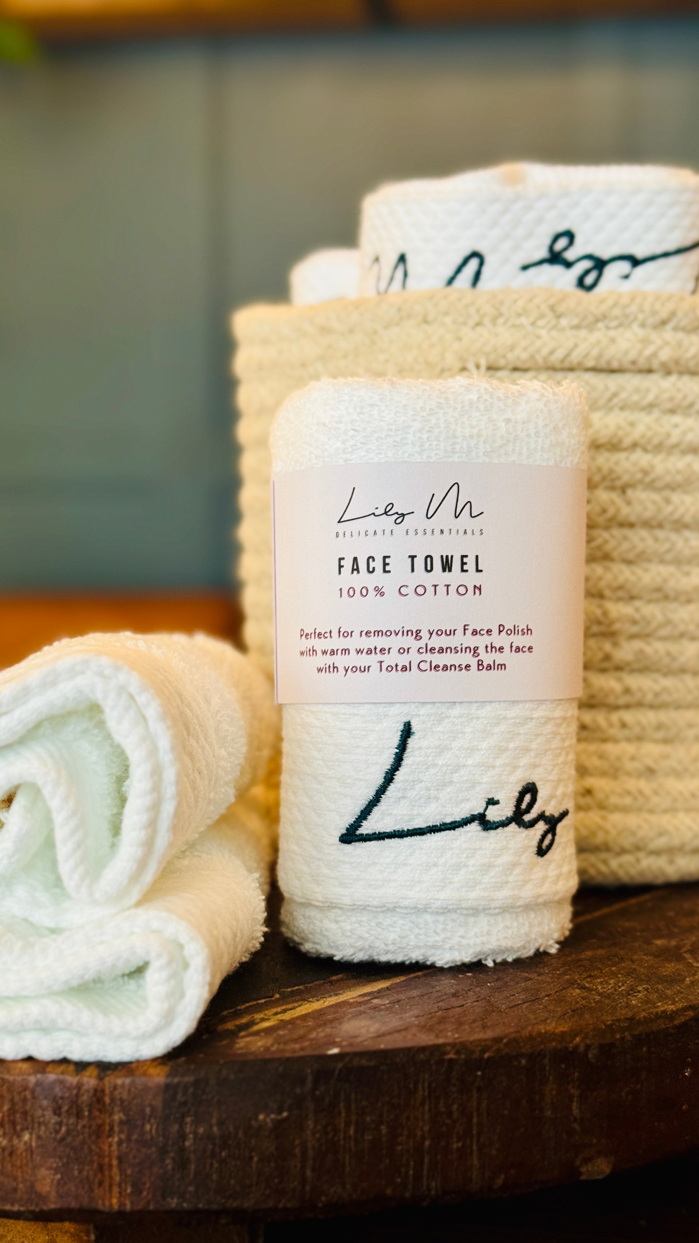 lily M branded face towel with a sleeve around it 