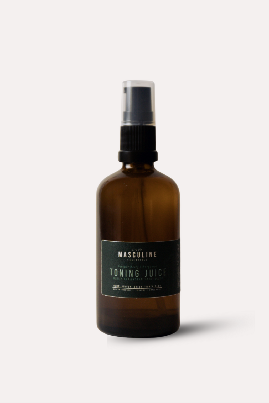 Brown spray bottle labeled 'Toning Juice' on a white background