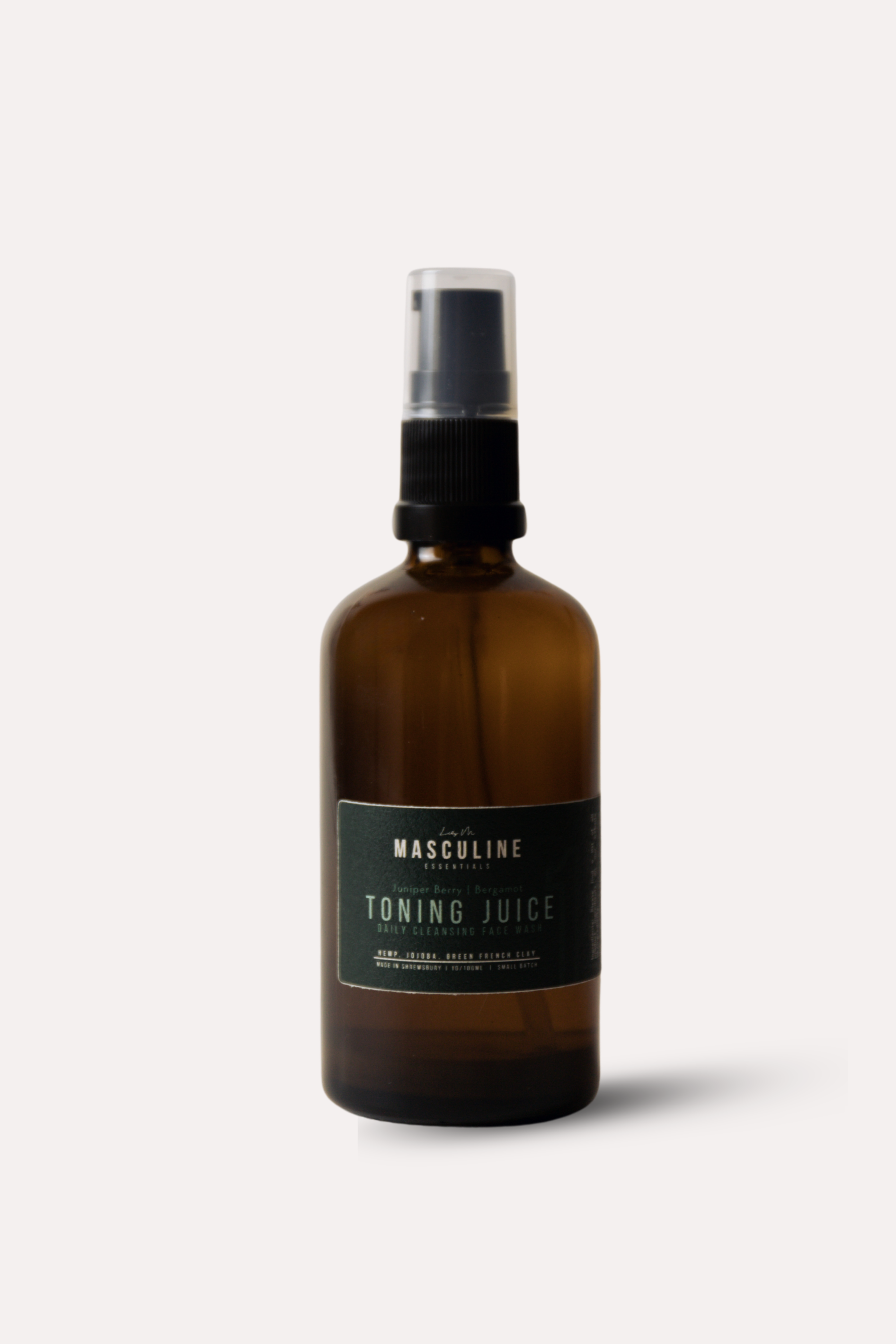 Brown spray bottle labeled 'Toning Juice' on a white background