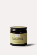 Jar of 'Total Cleanse' candle with a black lid on a white background