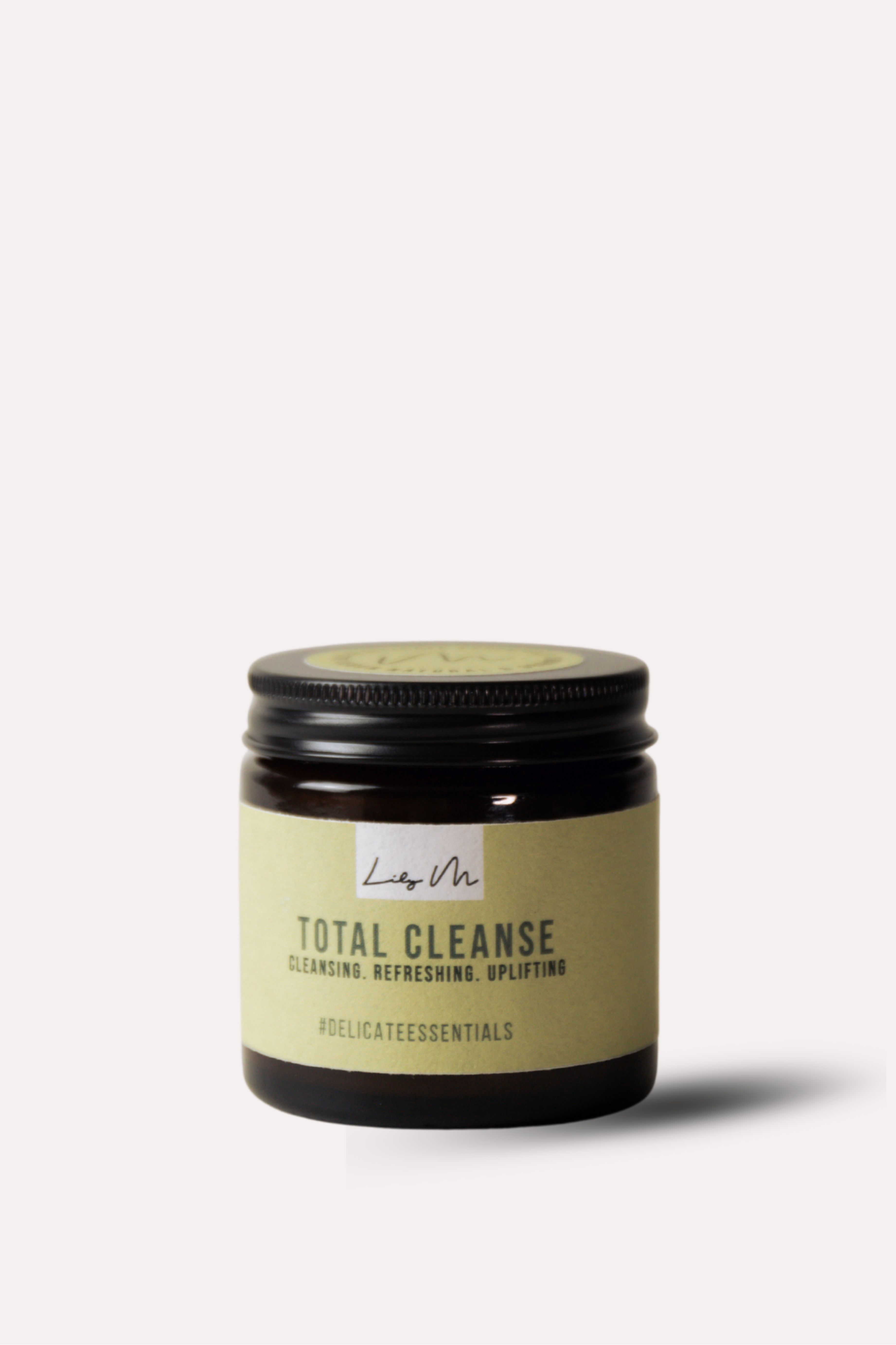 Jar of 'Total Cleanse' candle with a black lid on a white background