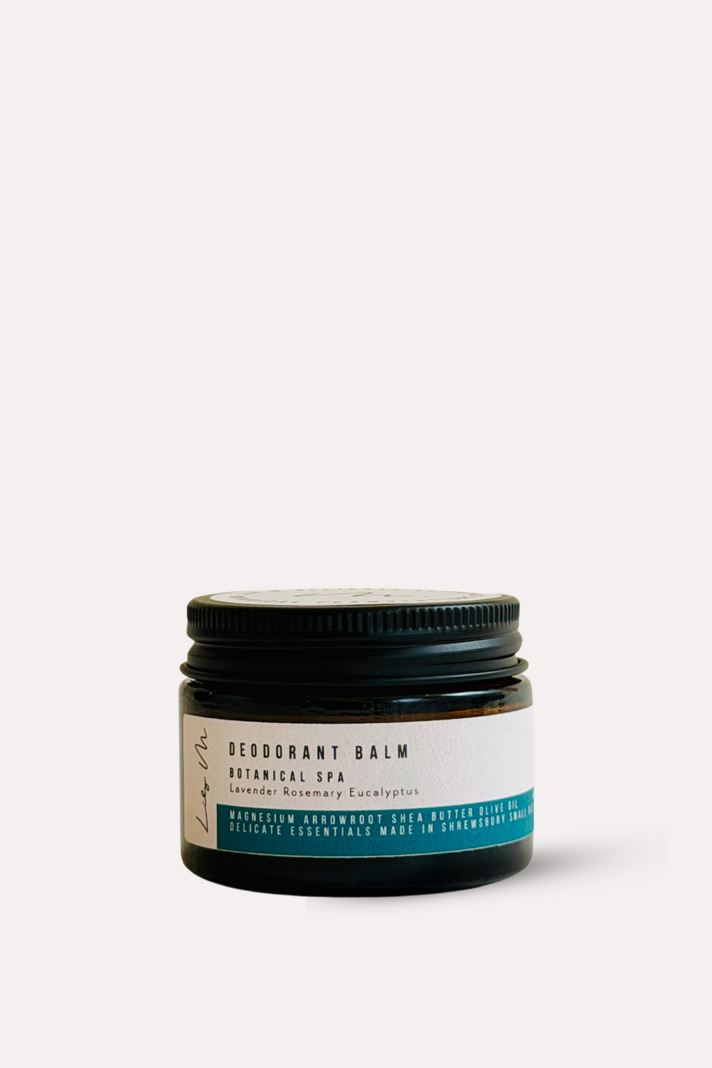 Jar of deodorant balm with a black lid on a white background