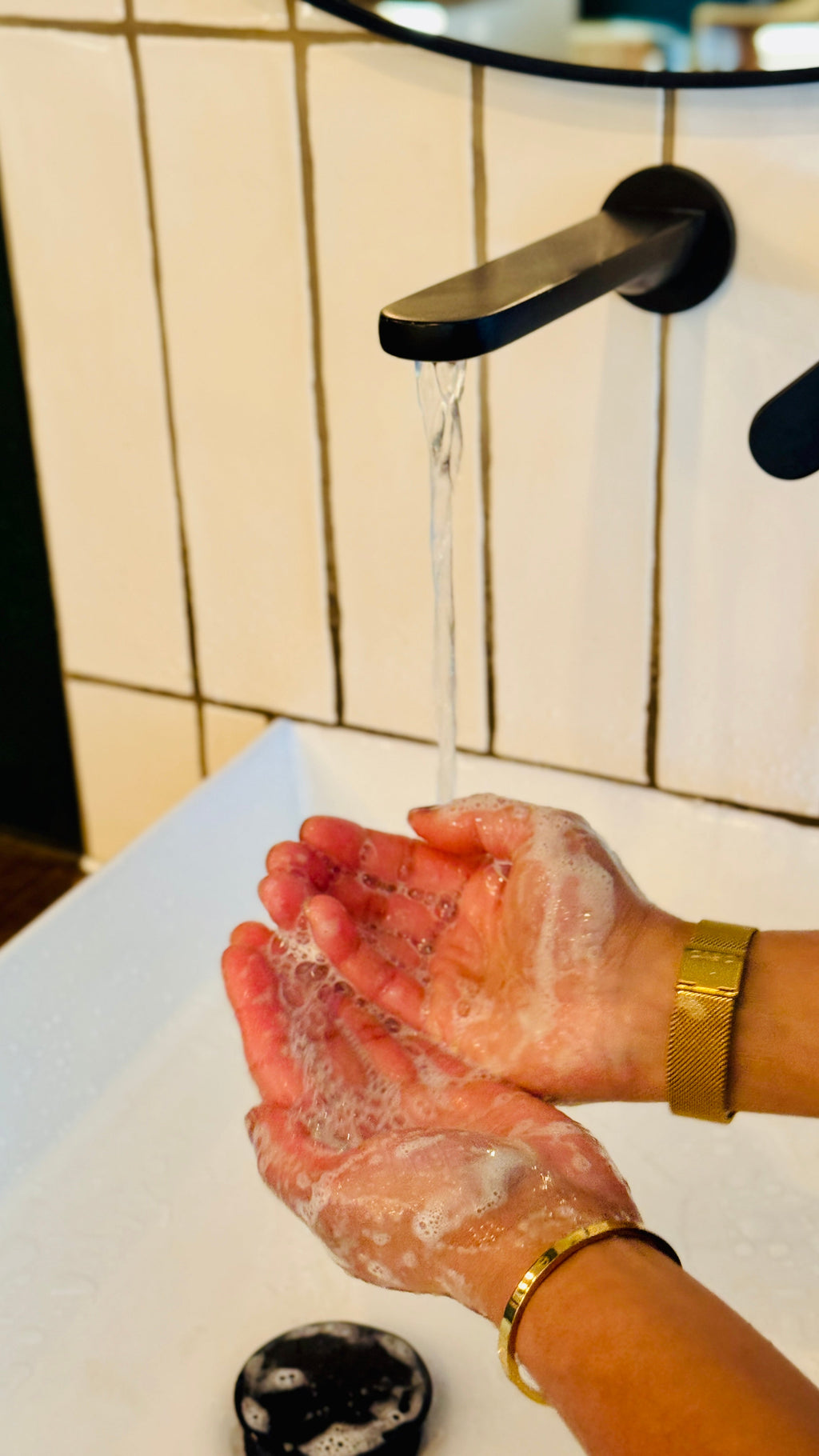 cedarwood lime & blackpepper being used with foam and bubbles on the hands 
